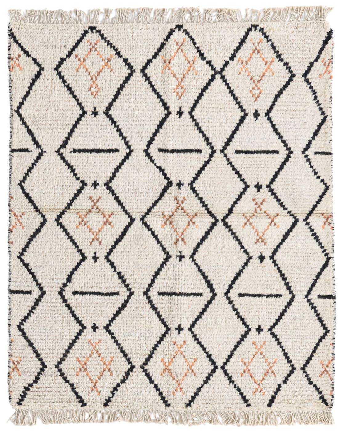 A 3x5 rectangular ivory shag rug with a black and peach tribal diamond pattern, featuring short fringe.