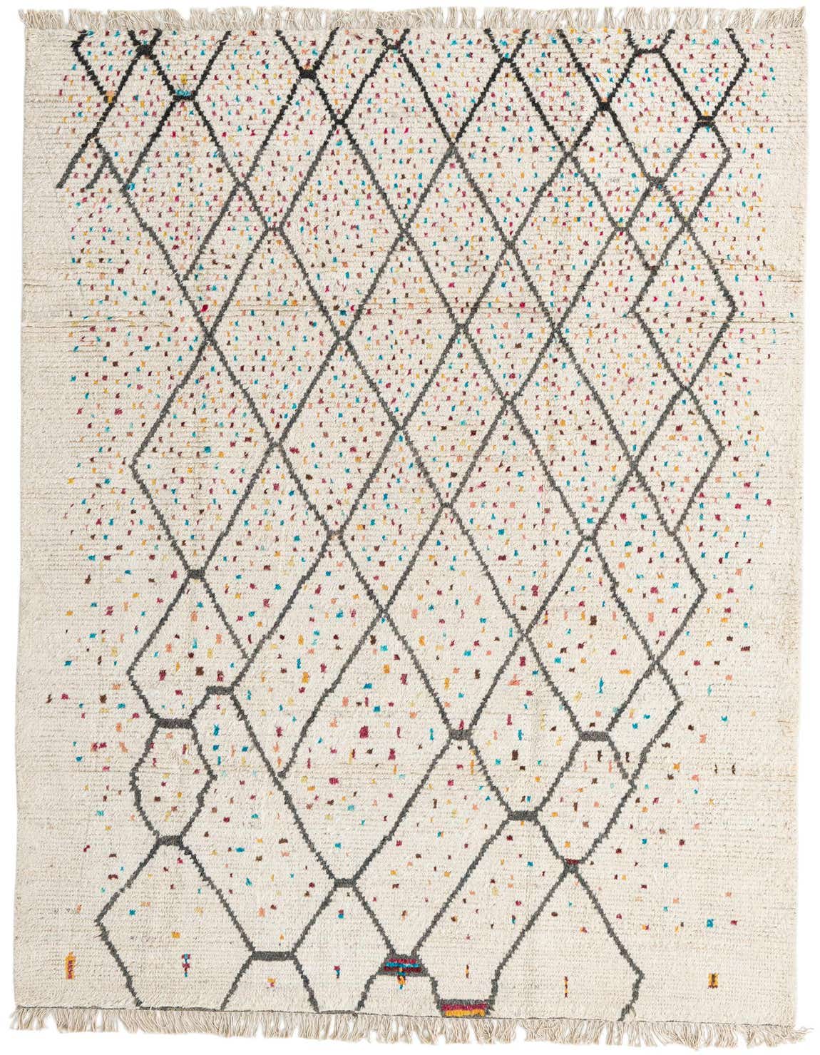 A 6x9 rectangular ivory shag rug with a modern tribal diamond pattern in charcoal, accented by colorful confetti-like flecks.