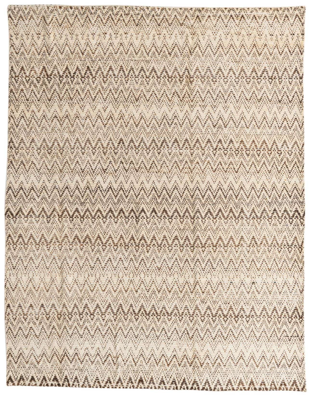 A 6x9 rectangular ivory and brown tribal shag rug with a modern zigzag stripe pattern, perfect for a living room.