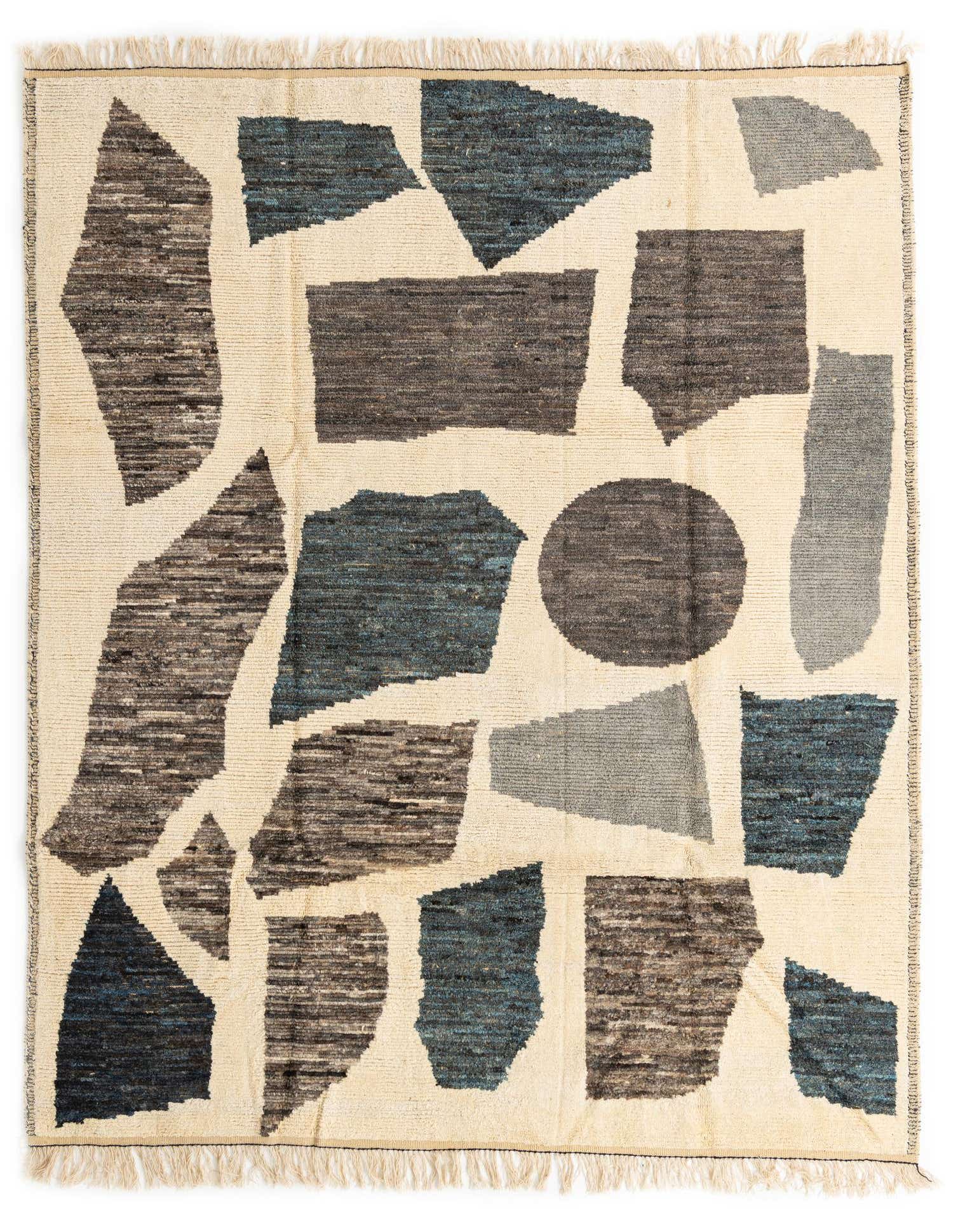 An 8x10 rectangular ivory shag rug with an abstract tribal pattern in shades of blue, gray, and brown.