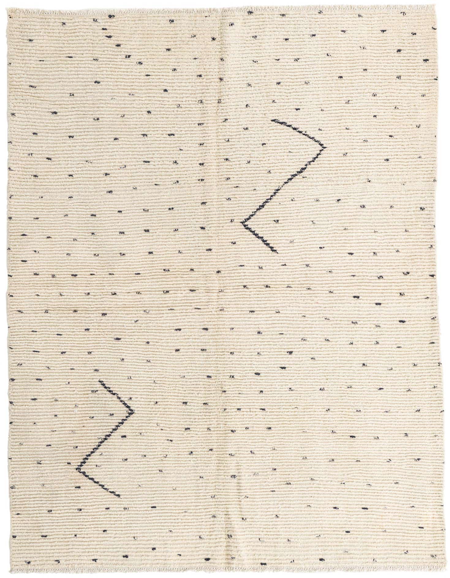 A 5x8 rectangular ivory shag rug with subtle black tribal zigzag patterns and scattered flecks.