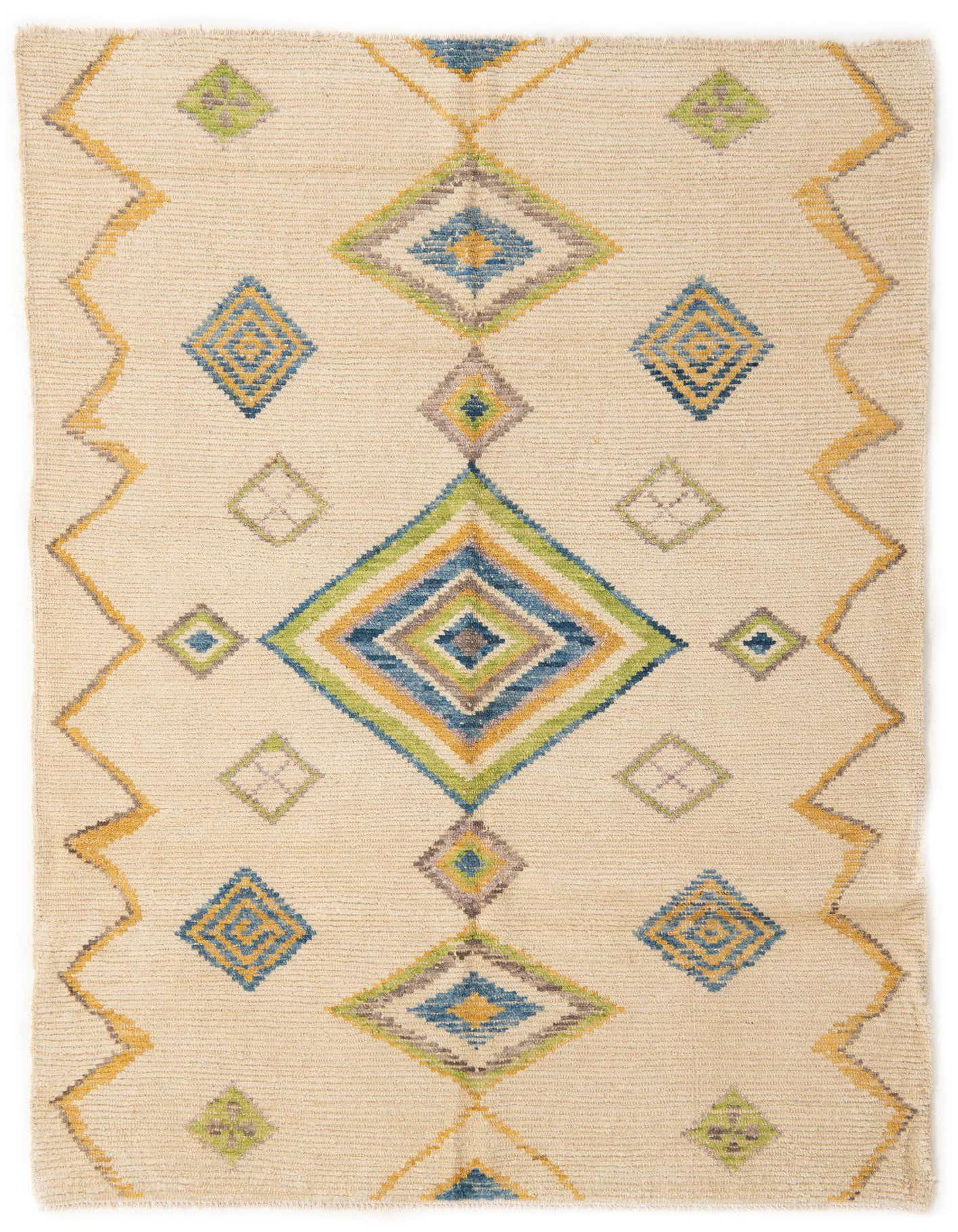 A 6x9 rectangular ivory wool shag rug with a modern tribal pattern of colorful diamonds and zigzags.