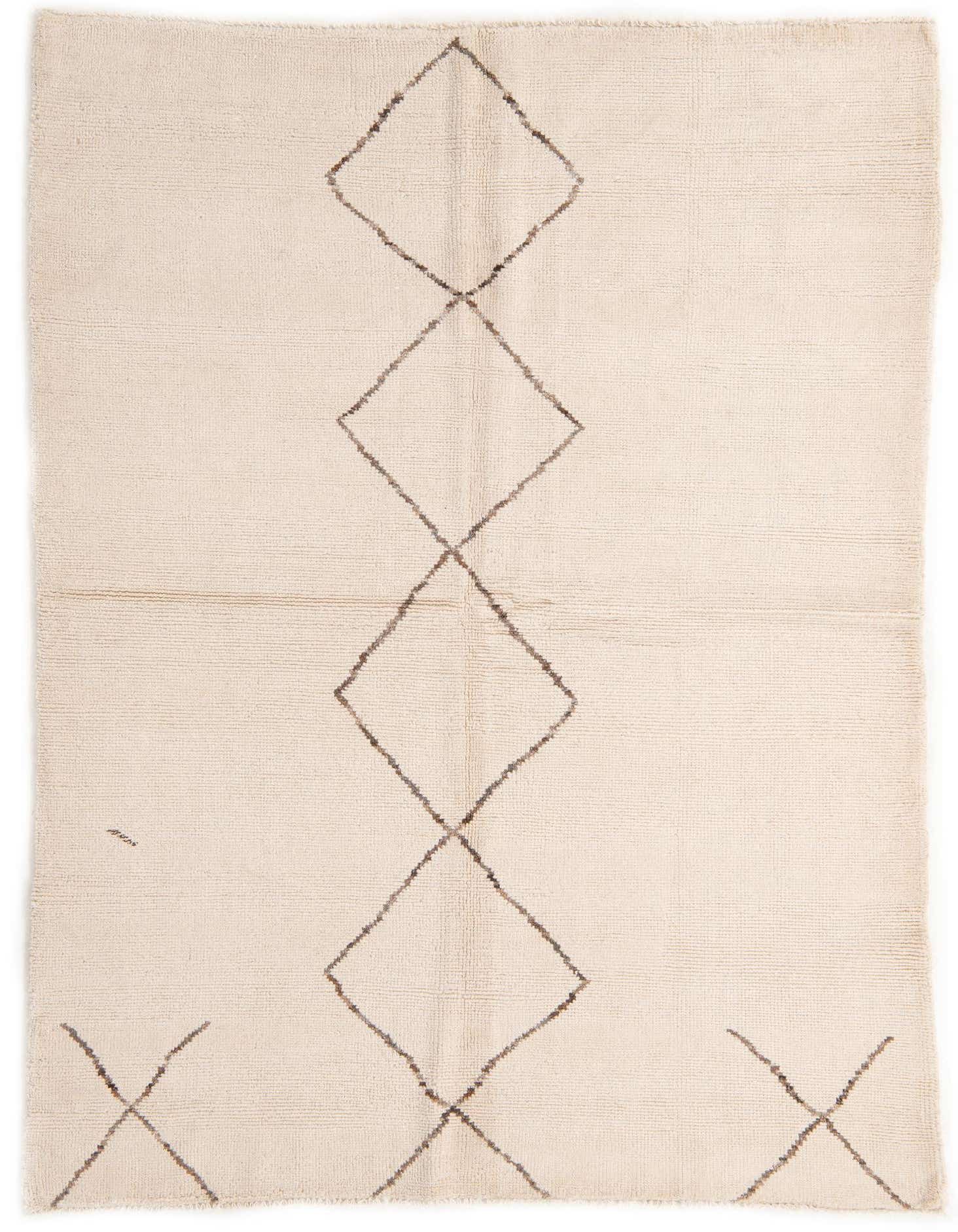 A 5x8 rectangular ivory shag rug with a central column of connected brown tribal diamond patterns.