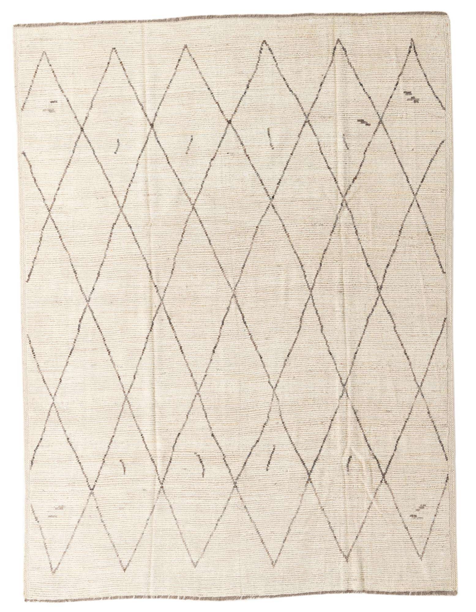 An 8x10 rectangular ivory wool shag rug with a modern tribal diamond pattern, perfect for a living room.