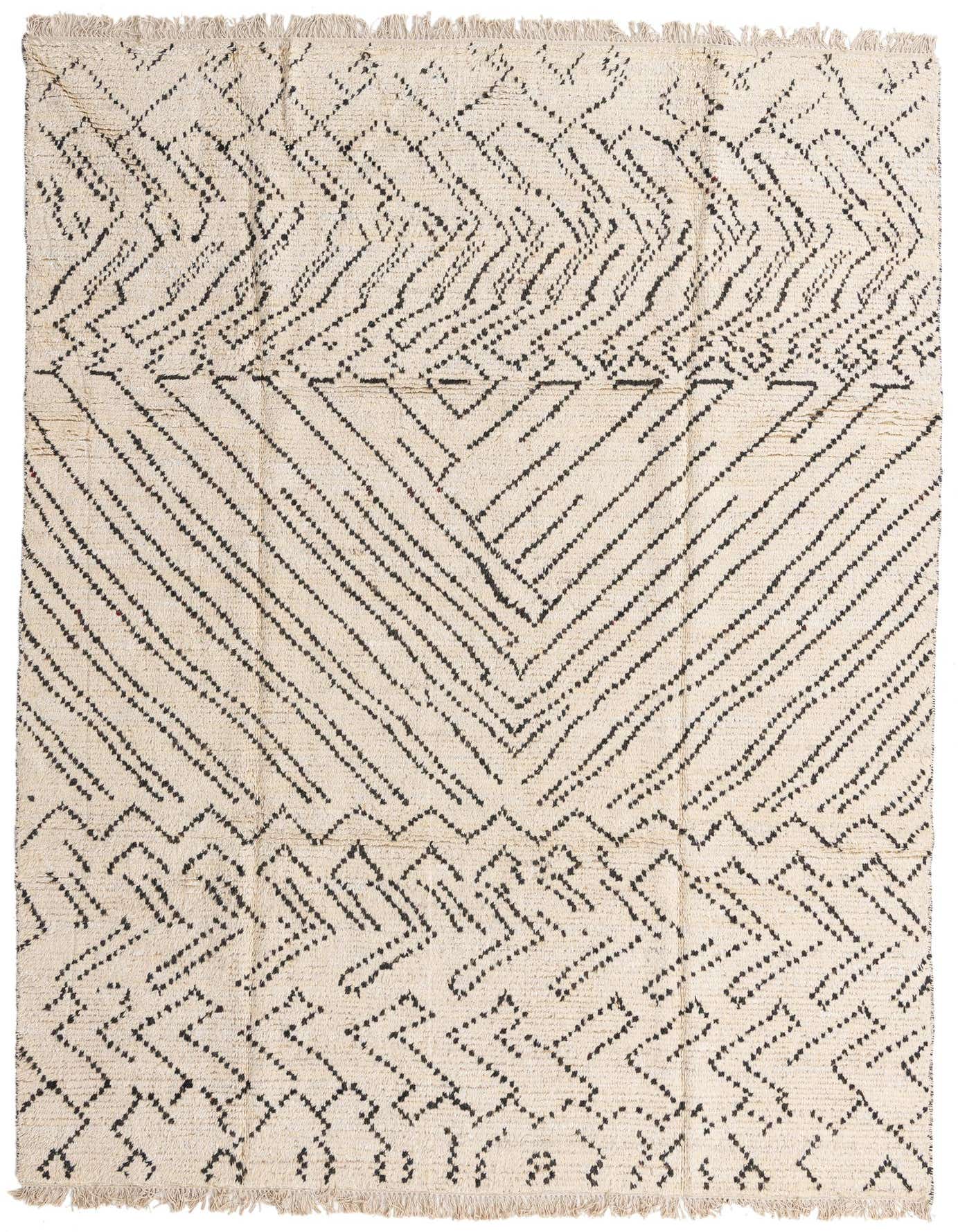 An 8x11 rectangular ivory wool shag rug with a modern tribal pattern of black geometric lines and fringe.
