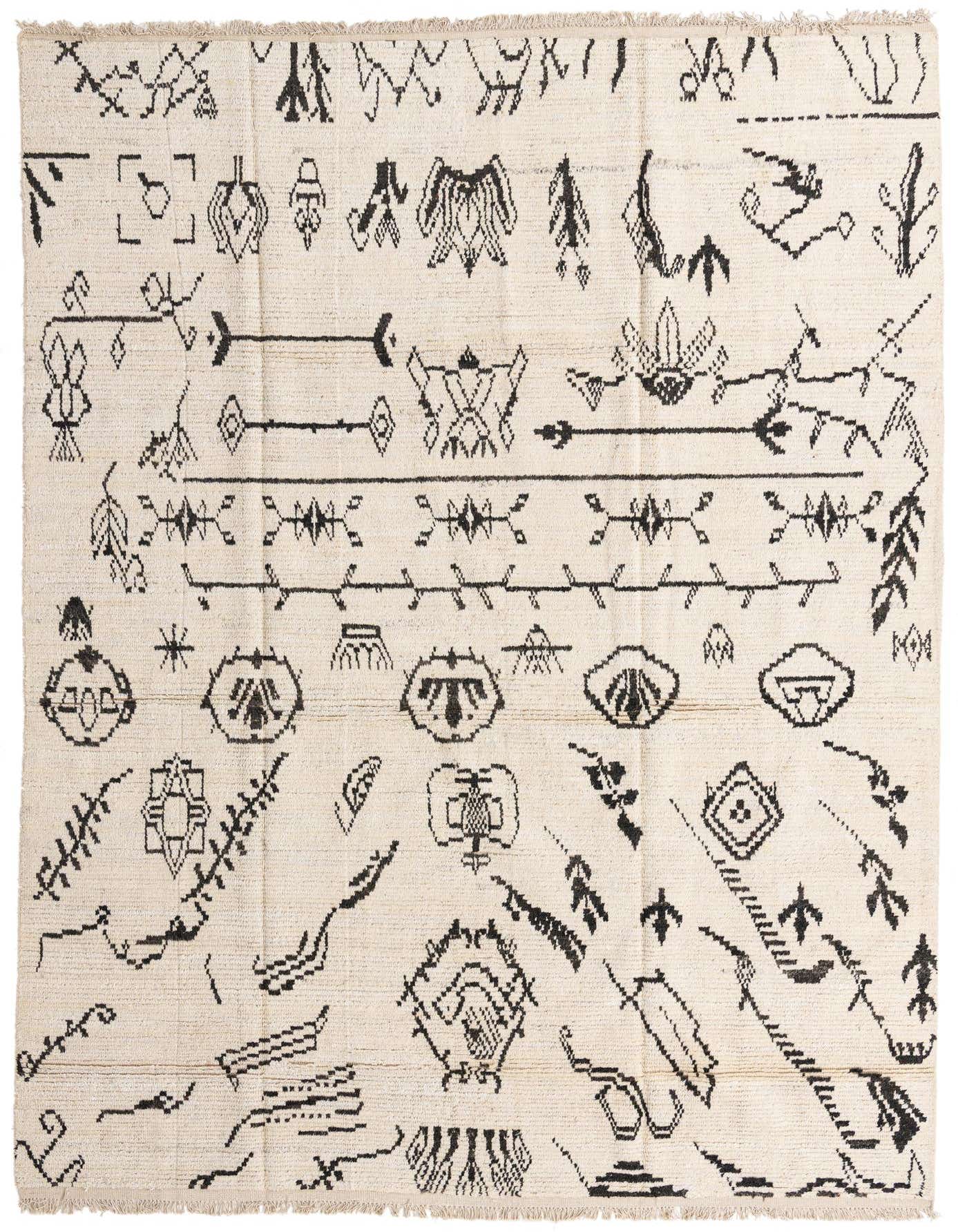 A 9x12 rectangular ivory wool shag rug with a modern tribal abstract pattern in black, suitable for a living room.