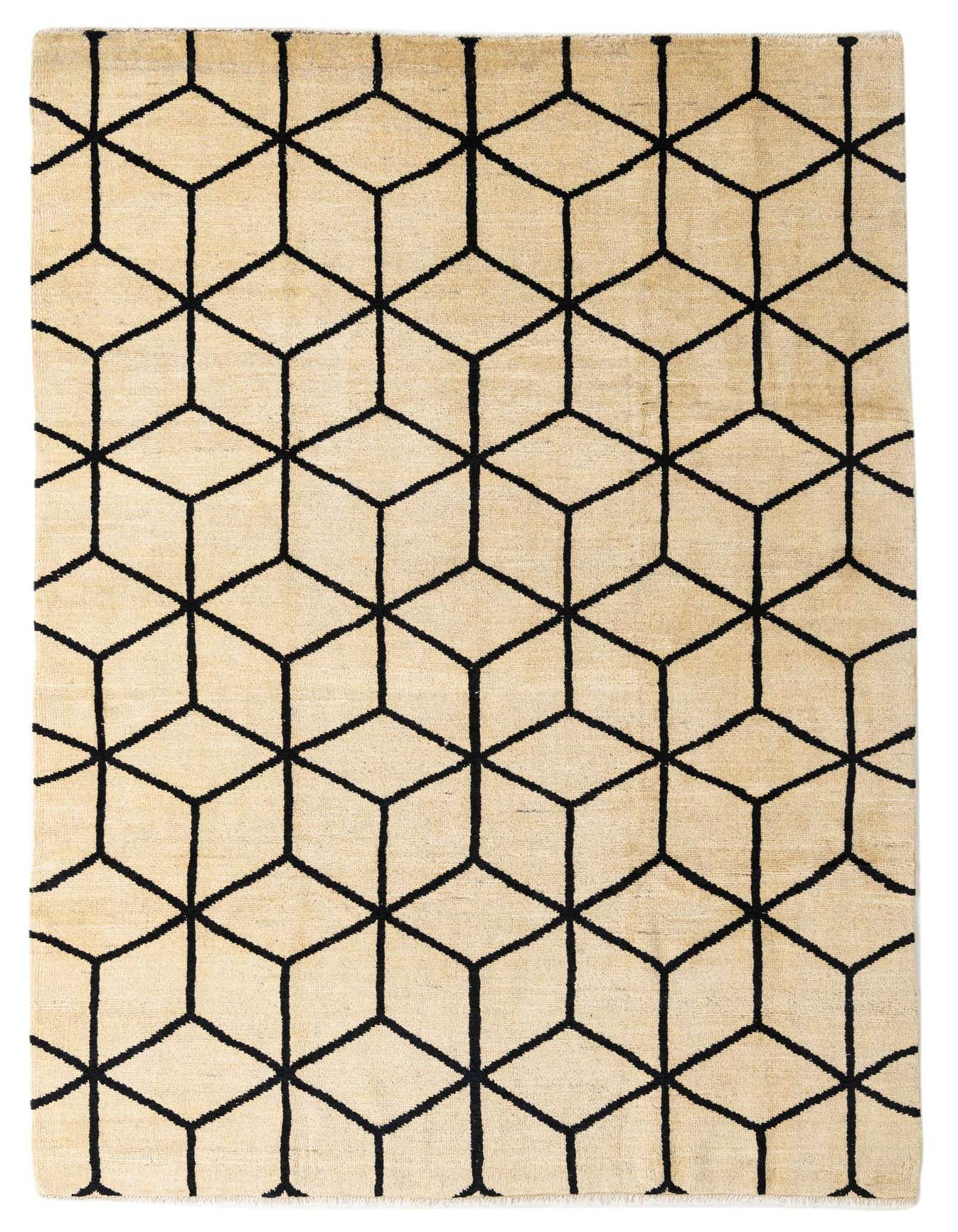 A 6x9 rectangular ivory shag rug with a bold black geometric cube pattern, ideal for a modern living room.