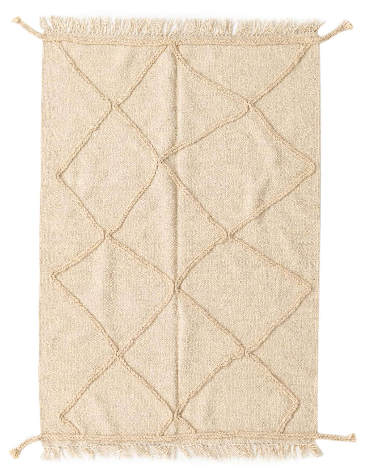A 3x5 rectangular ivory wool shag rug with a raised tribal diamond pattern and braided tassels.