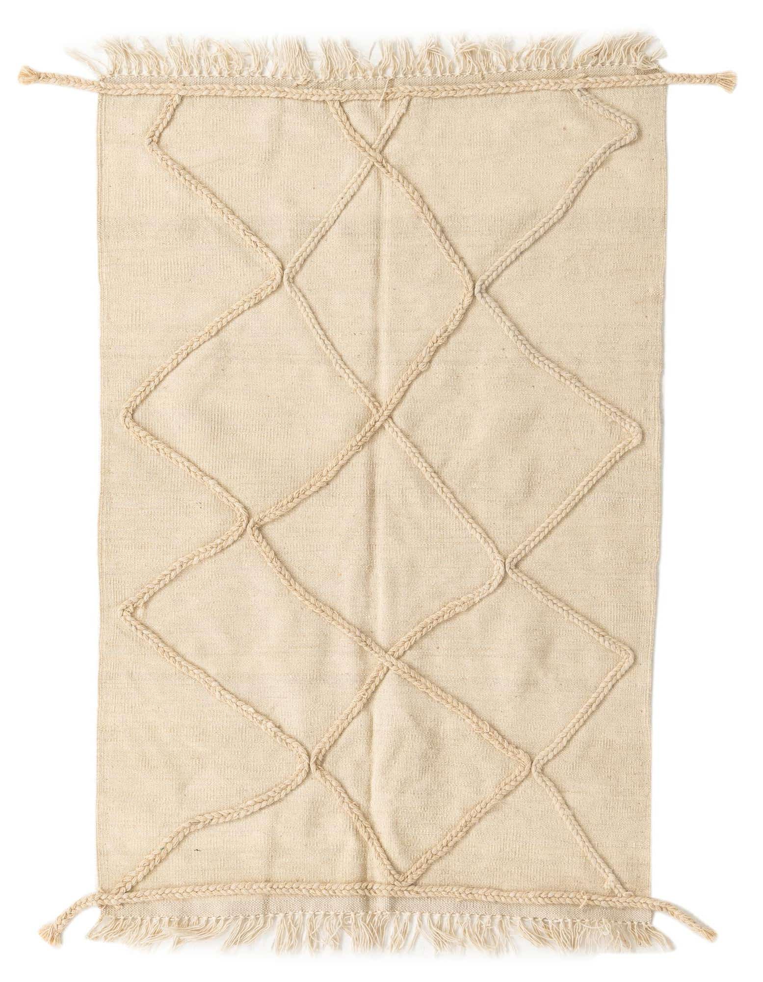 A 3x5 rectangular ivory wool shag rug with a raised braided diamond pattern and fringed edges.