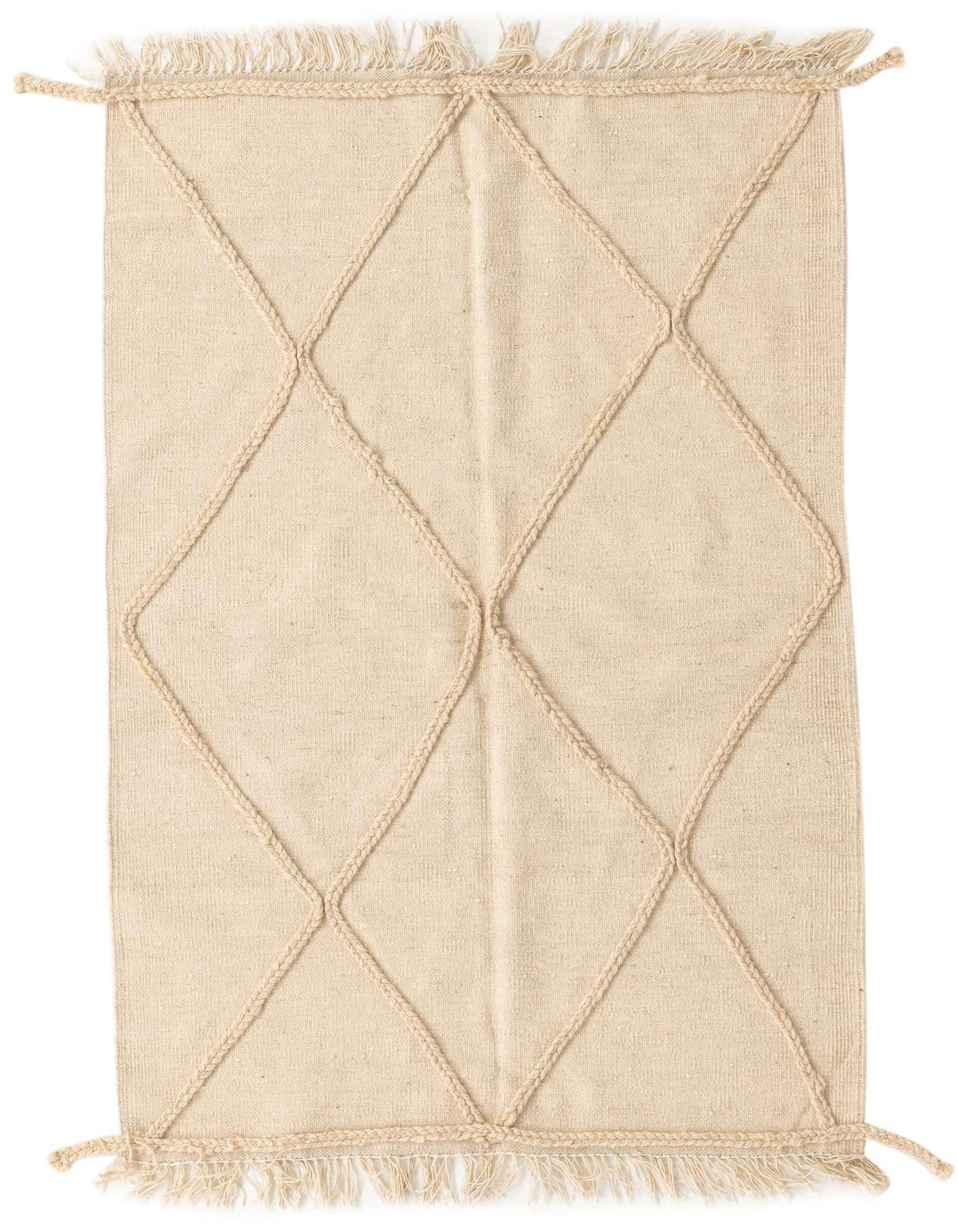 A 3x5 rectangular ivory wool shag rug featuring a modern tribal diamond pattern created with raised braided lines and fringe.