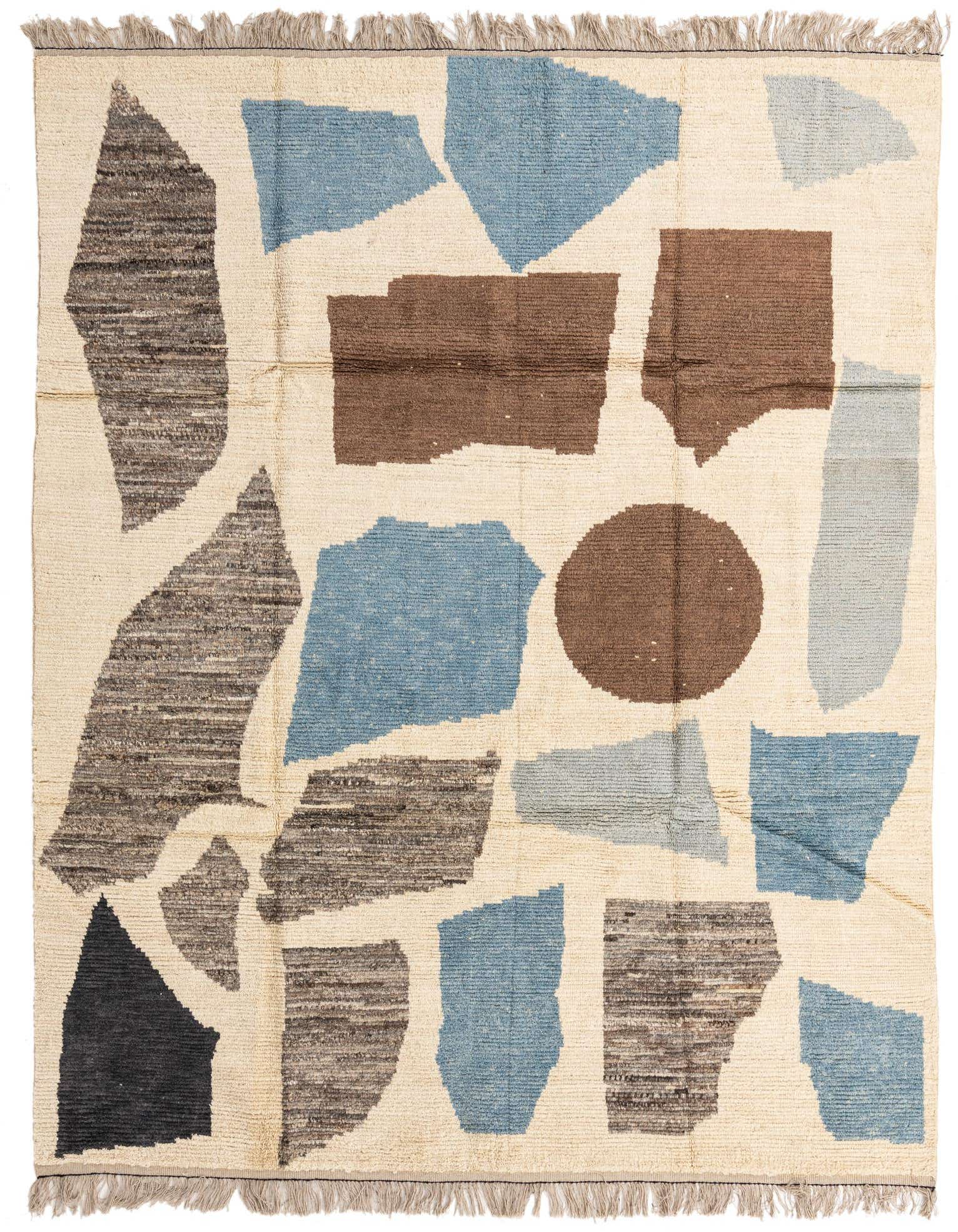 8x11 rectangular ivory wool shag rug with an abstract tribal pattern in blue, brown, and dark gray shapes.