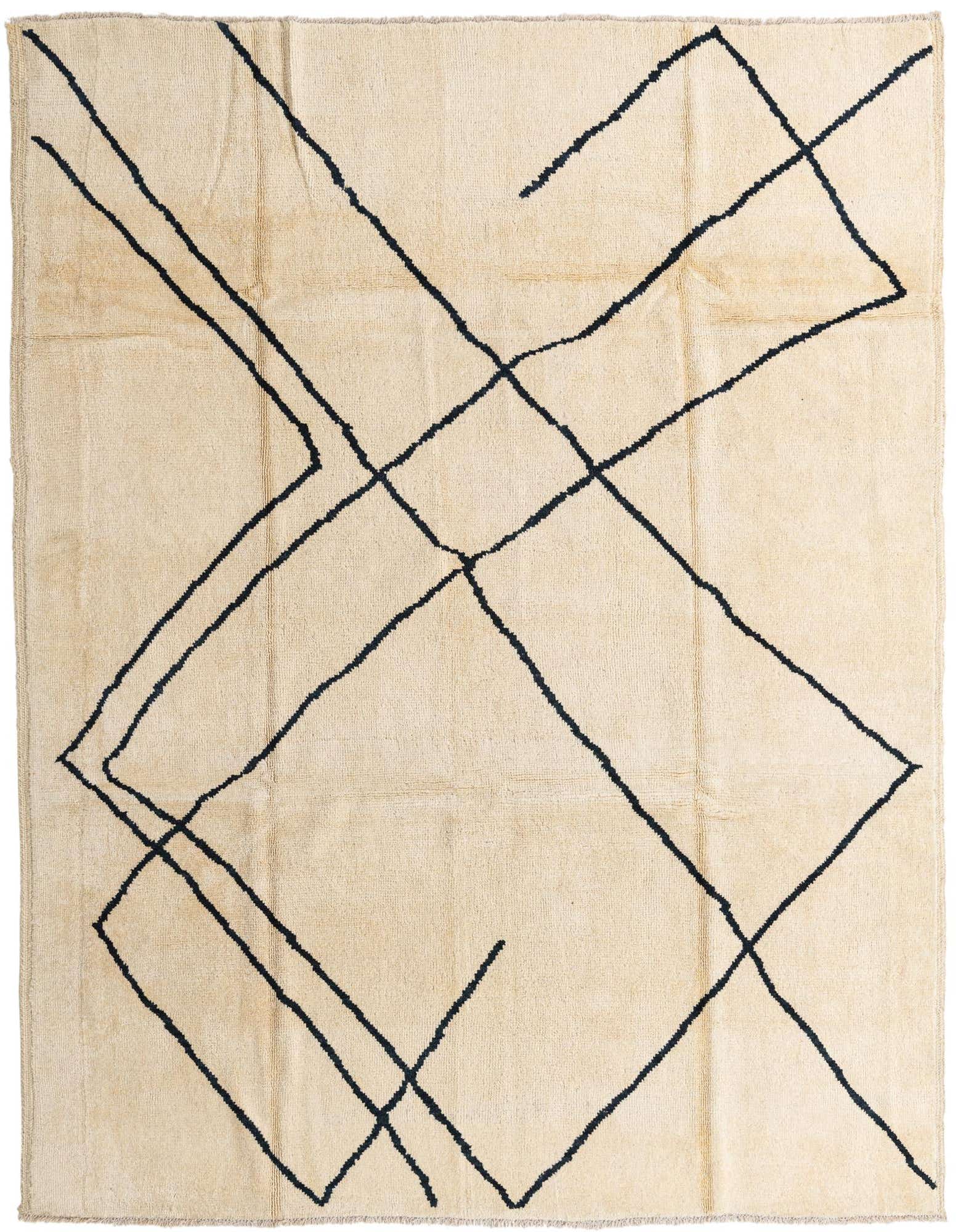 An 8x10 rectangular ivory shag rug with a modern tribal abstract pattern of intersecting black lines.