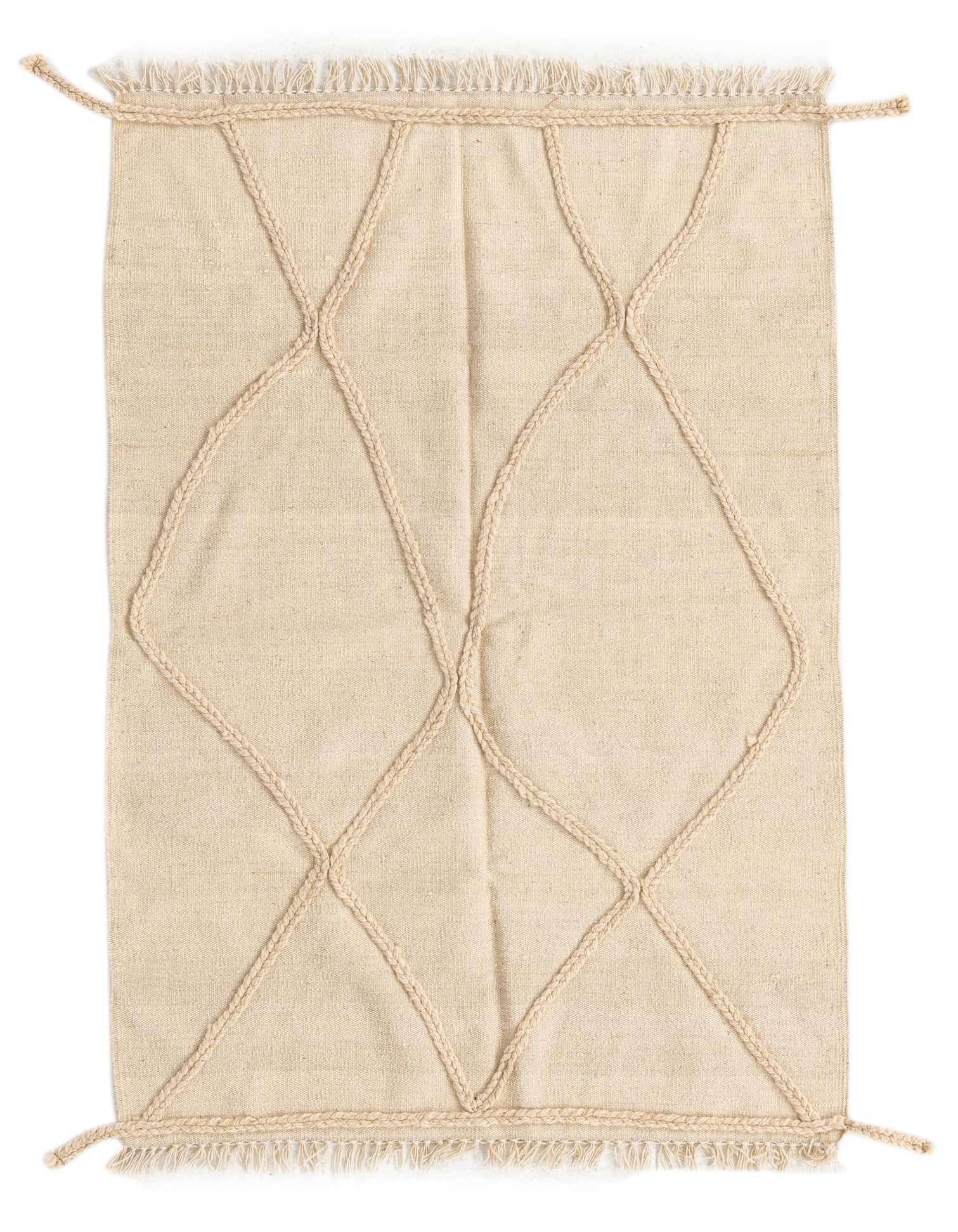 A 3x5 rectangular ivory wool shag rug with a raised braided tribal diamond pattern and fringe.