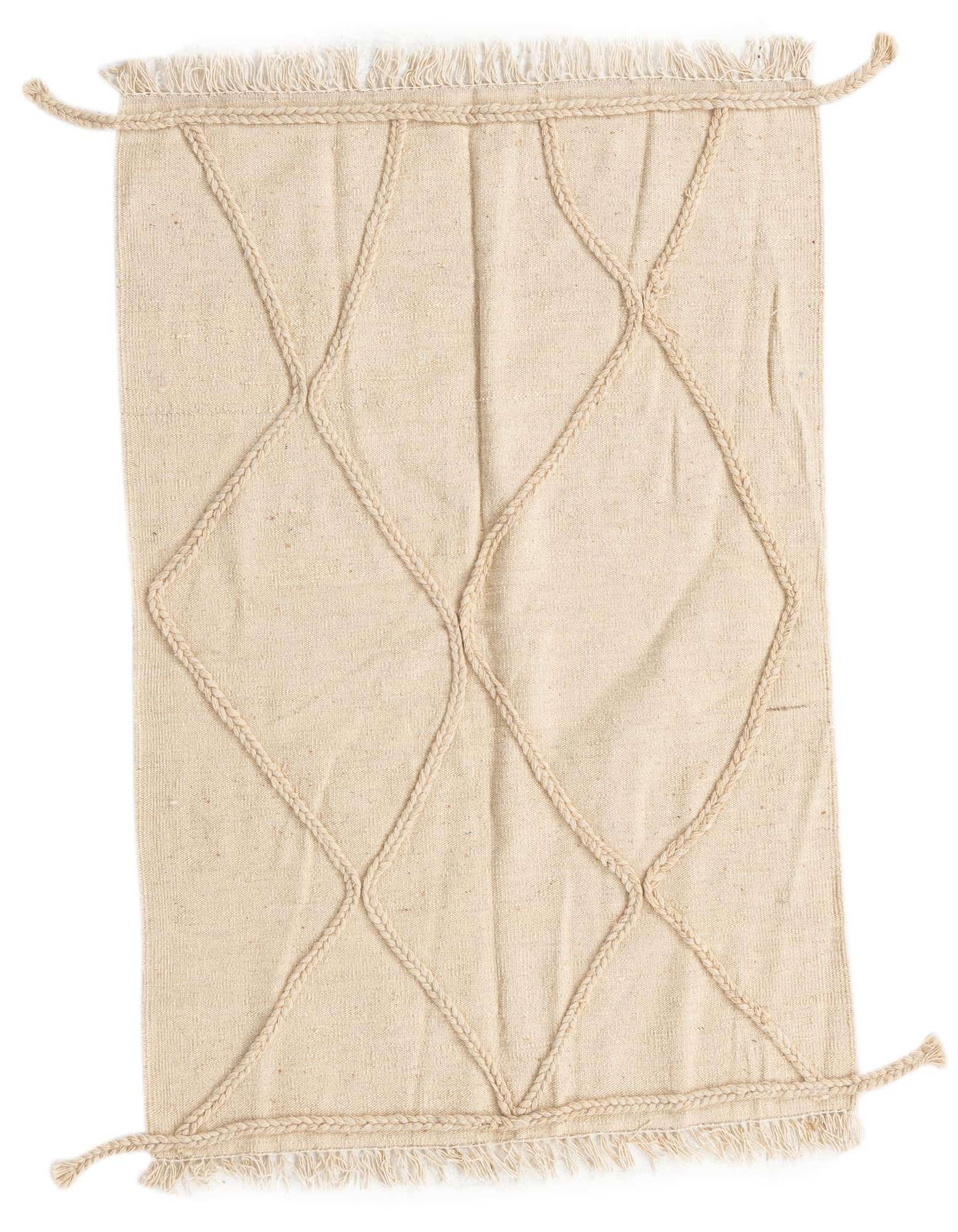 A 3x5 rectangular ivory wool shag rug with a braided tribal diamond pattern and fringed edges.
