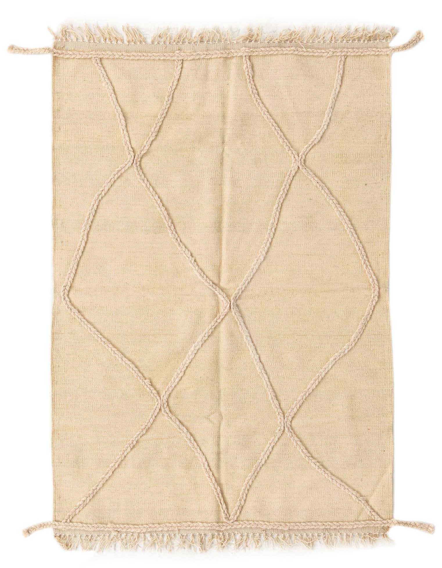 A 3x5 rectangular ivory wool shag rug featuring a tribal diamond pattern made from braided rope, with fringed edges.