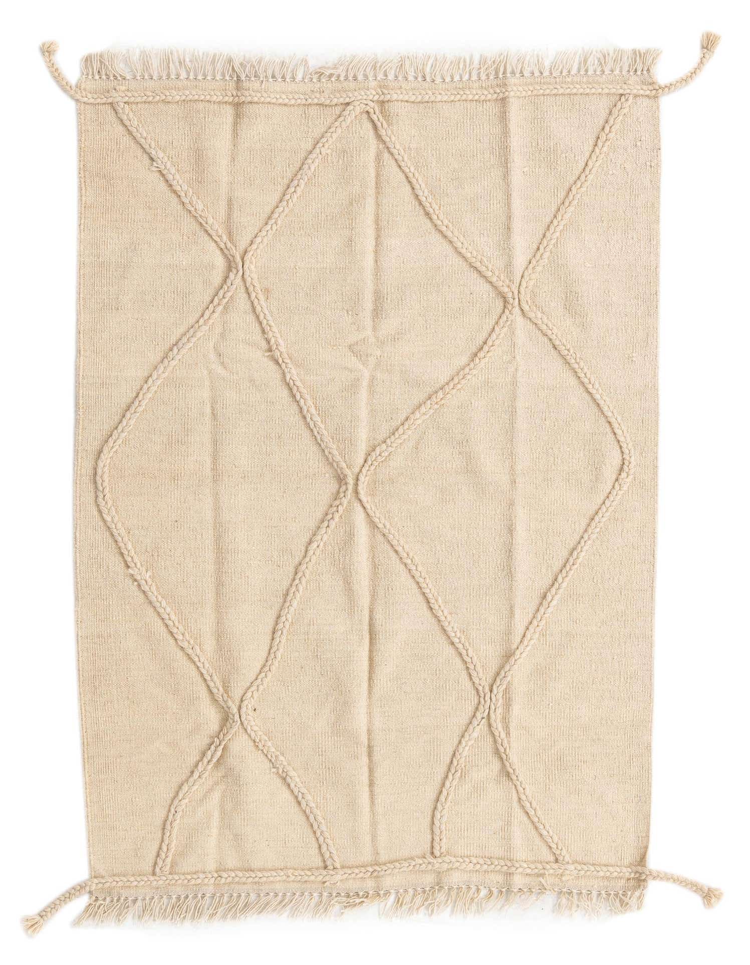 A 3x5 rectangular ivory wool shag rug with a braided diamond tribal pattern and fringed edges.