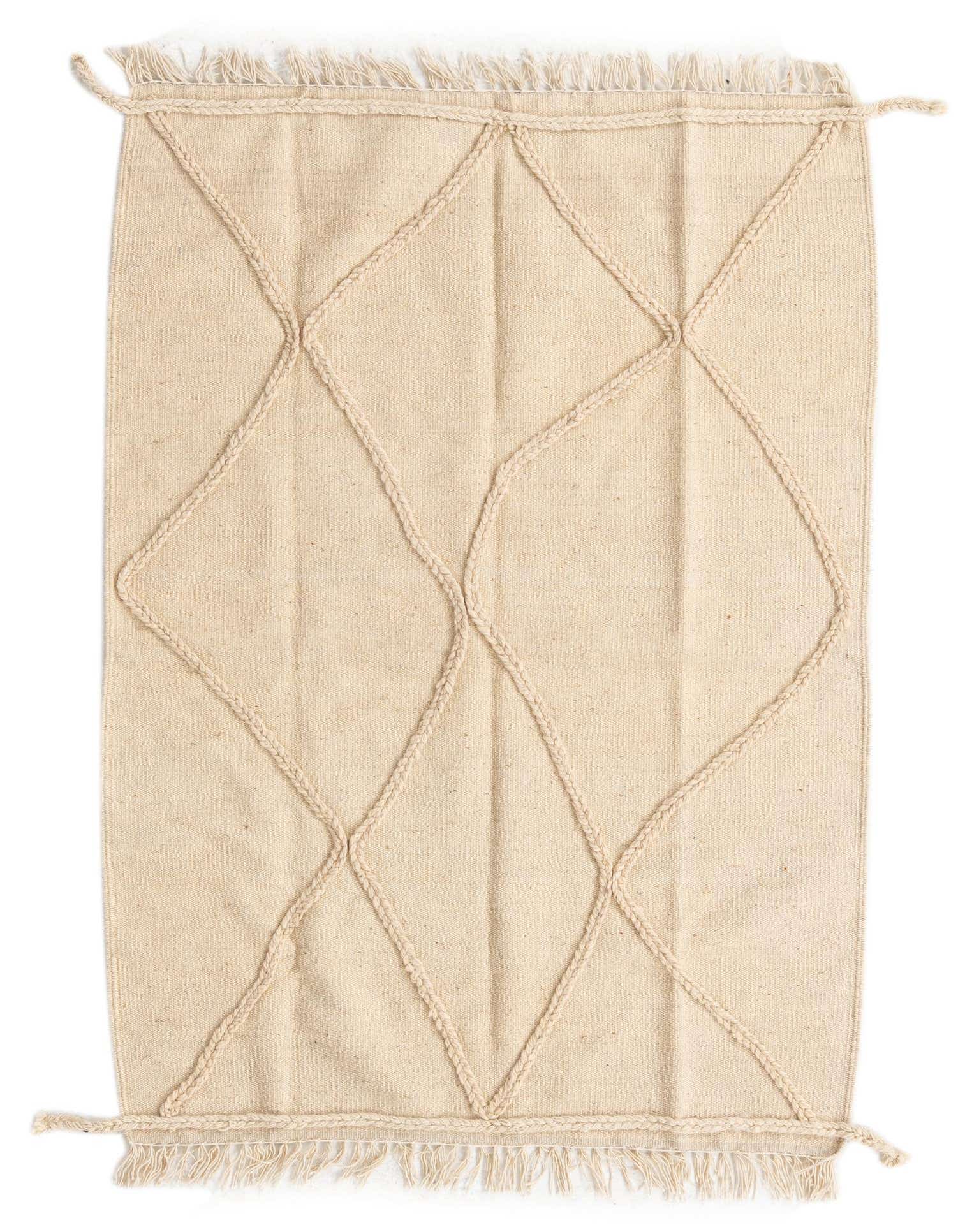 A 3x5 rectangular ivory wool shag rug with a raised tribal diamond pattern and fringe.