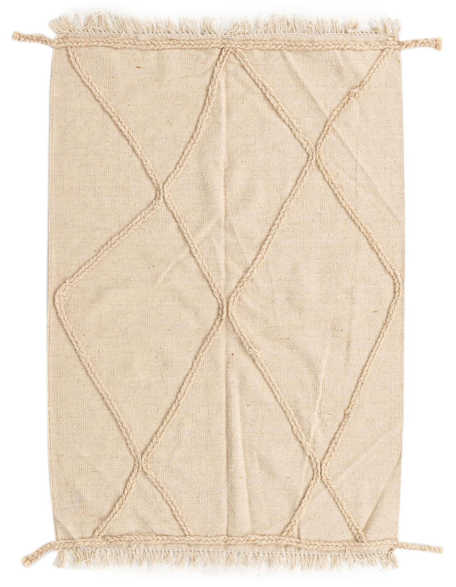 A 3x5 rectangular ivory wool shag rug with a braided tribal diamond pattern and fringed edges.