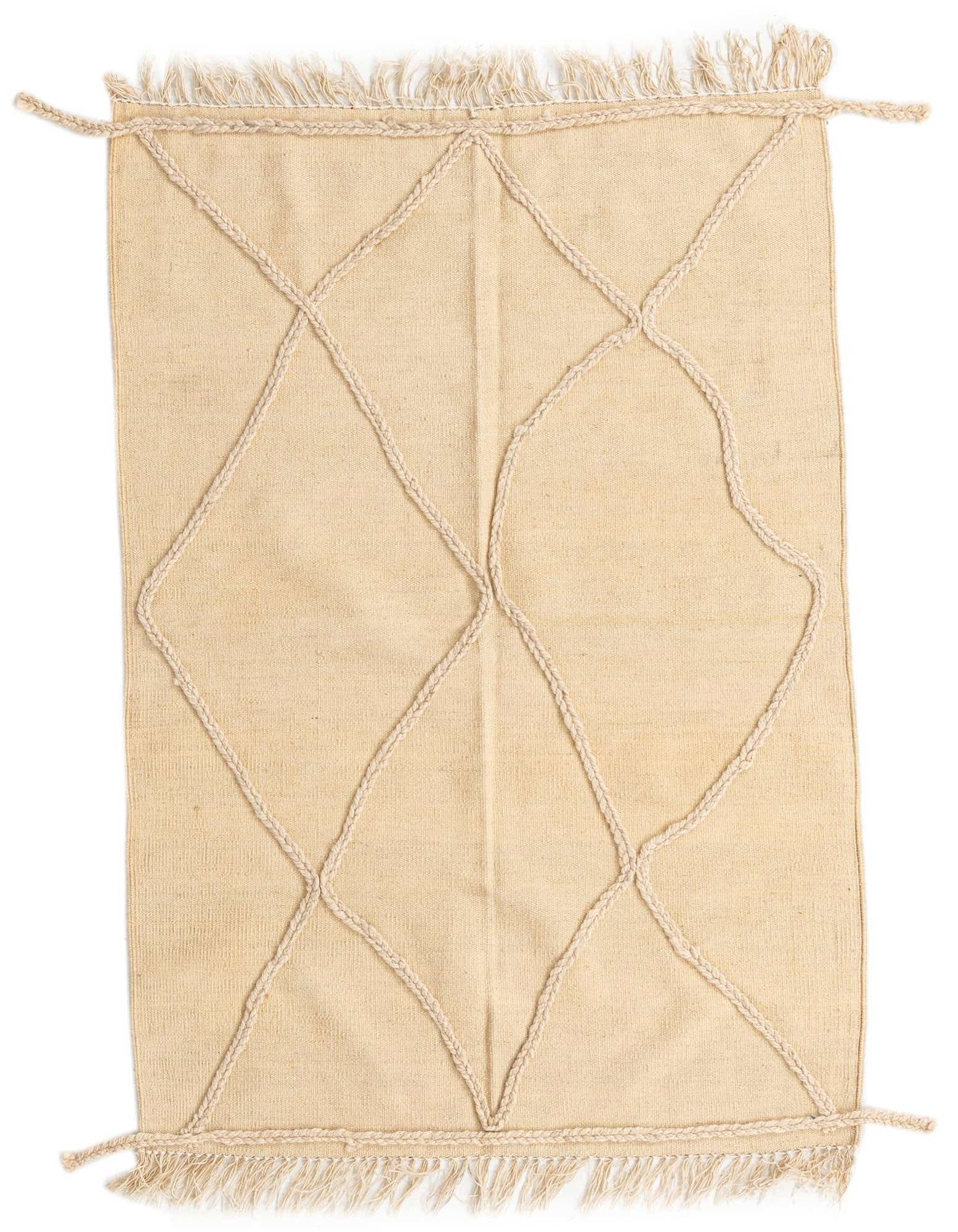 A 3x5 rectangular ivory shag rug with a braided tribal diamond pattern and fringe, suitable for indoor use.