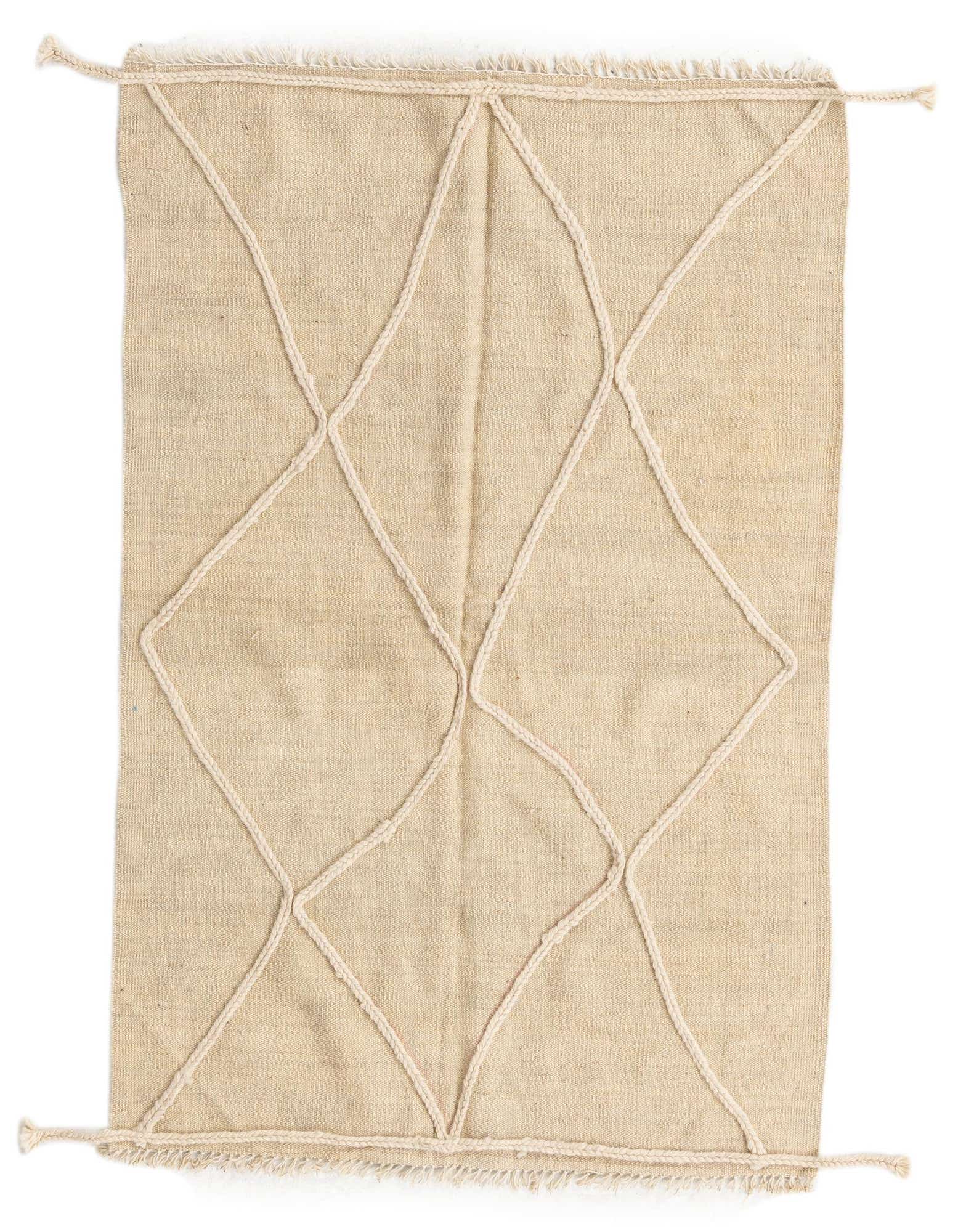 A 3x5 rectangular ivory wool shag rug with a raised white tribal diamond pattern and fringed edges.