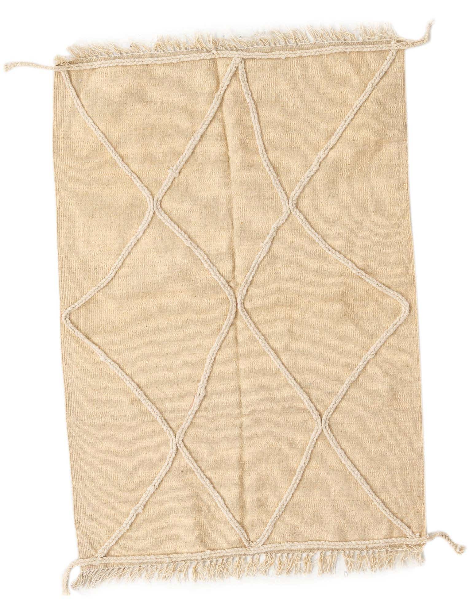 A 3x5 rectangular ivory wool shag rug featuring a raised white braided diamond pattern and short fringe.