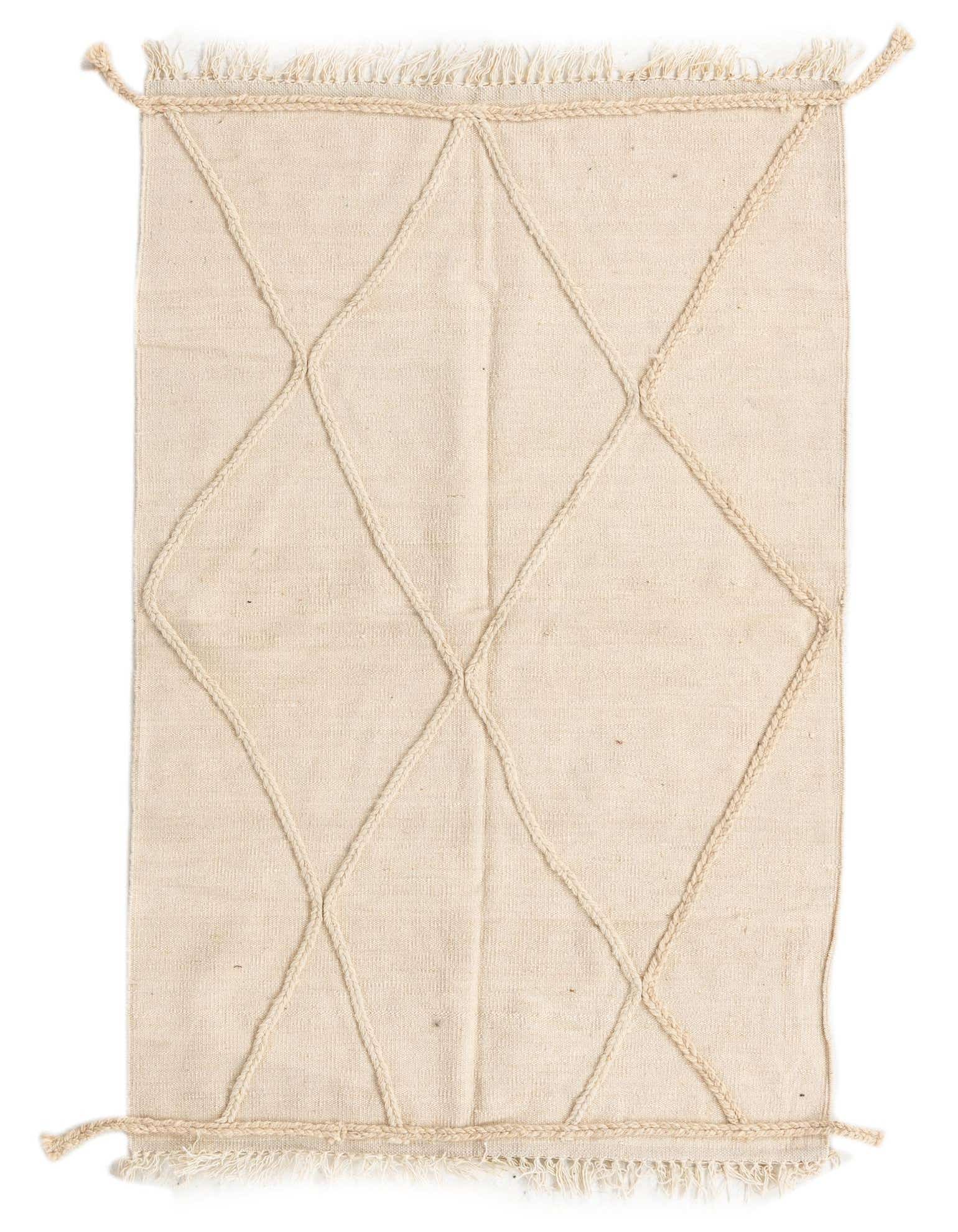 A 3x5 rectangular ivory wool shag rug with a modern tribal diamond pattern and braided edges, suitable for an indoor living space.
