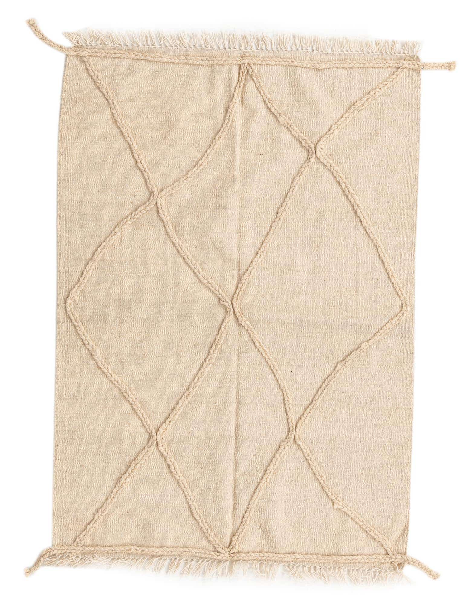 A 3x5 rectangular ivory wool shag rug with a raised braided tribal diamond pattern and fringed edges.