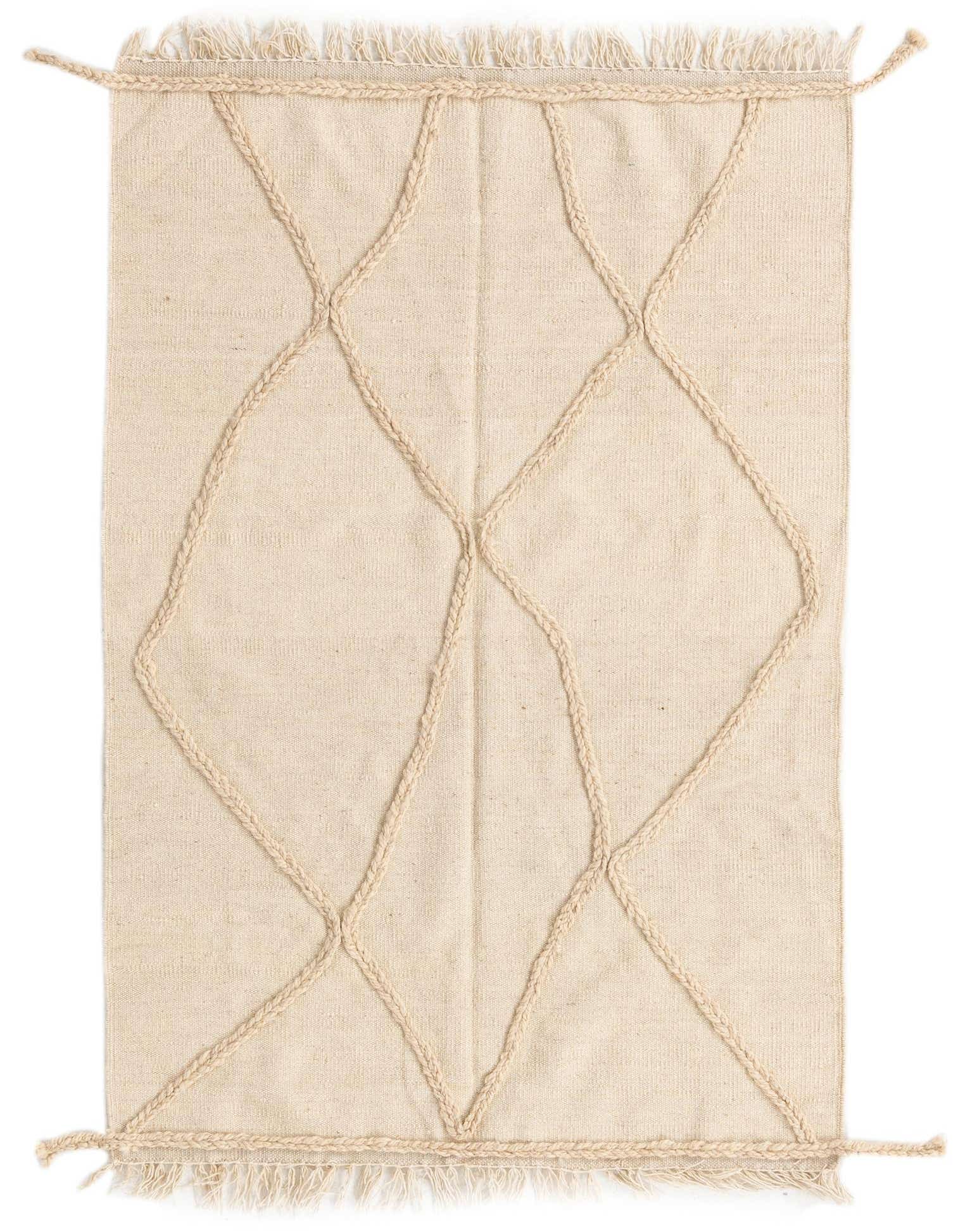 A 3x5 rectangular ivory wool shag rug with a raised braided tribal diamond pattern and fringed edges.