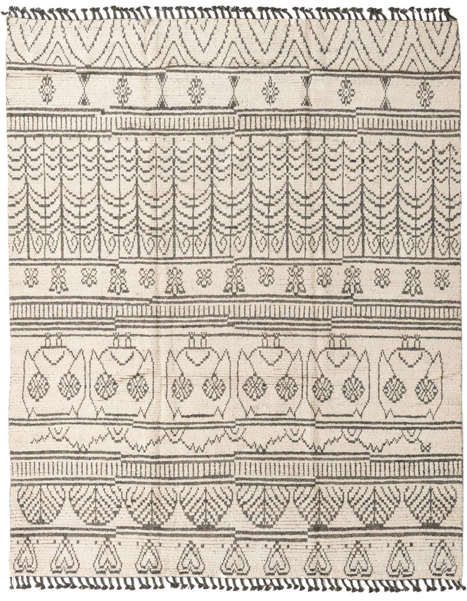 An 8x10 rectangular ivory shag rug with a modern tribal pattern in charcoal gray, featuring abstract trees and geometric shapes.