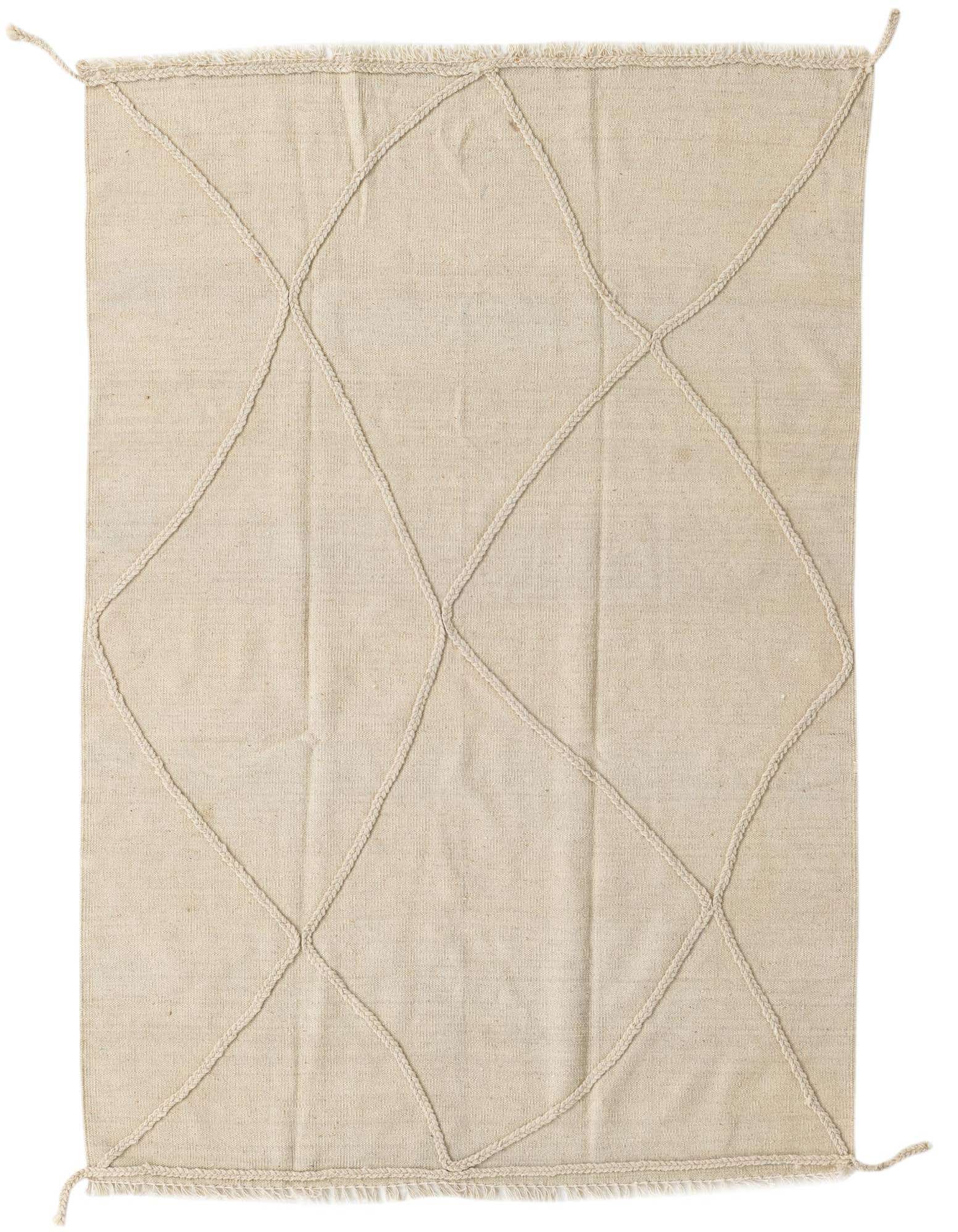 A 4x6 rectangular ivory wool shag rug featuring a subtle tribal diamond pattern created by braided ropes.