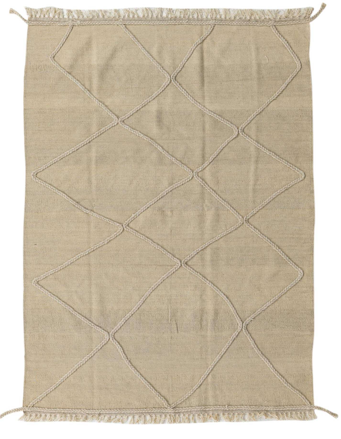 A 4x6 rectangular ivory wool shag rug with a braided diamond pattern and fringe ends, perfect for a living room.