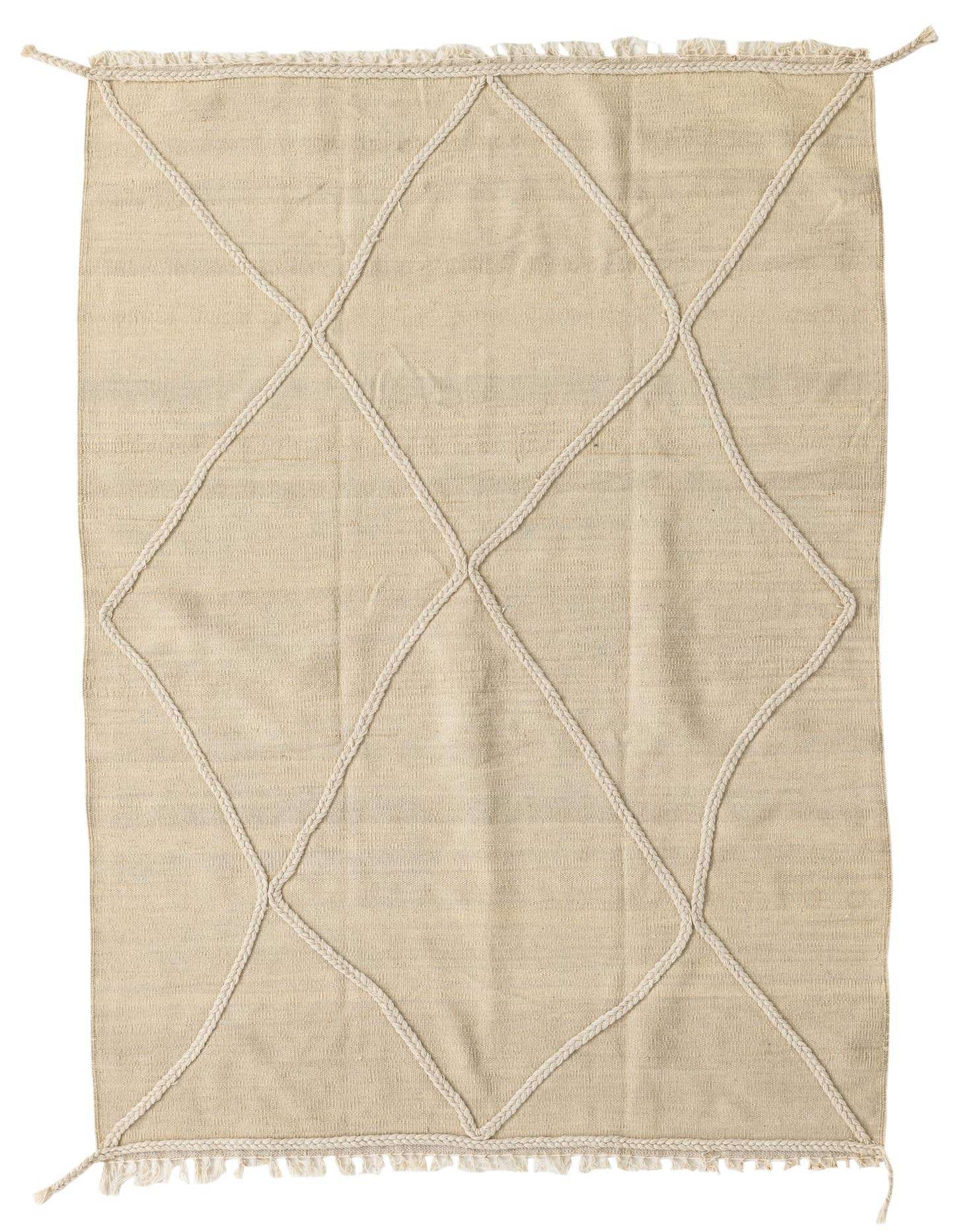 A 4x6 rectangular ivory wool shag rug with a modern tribal diamond pattern made from braided white ropes.