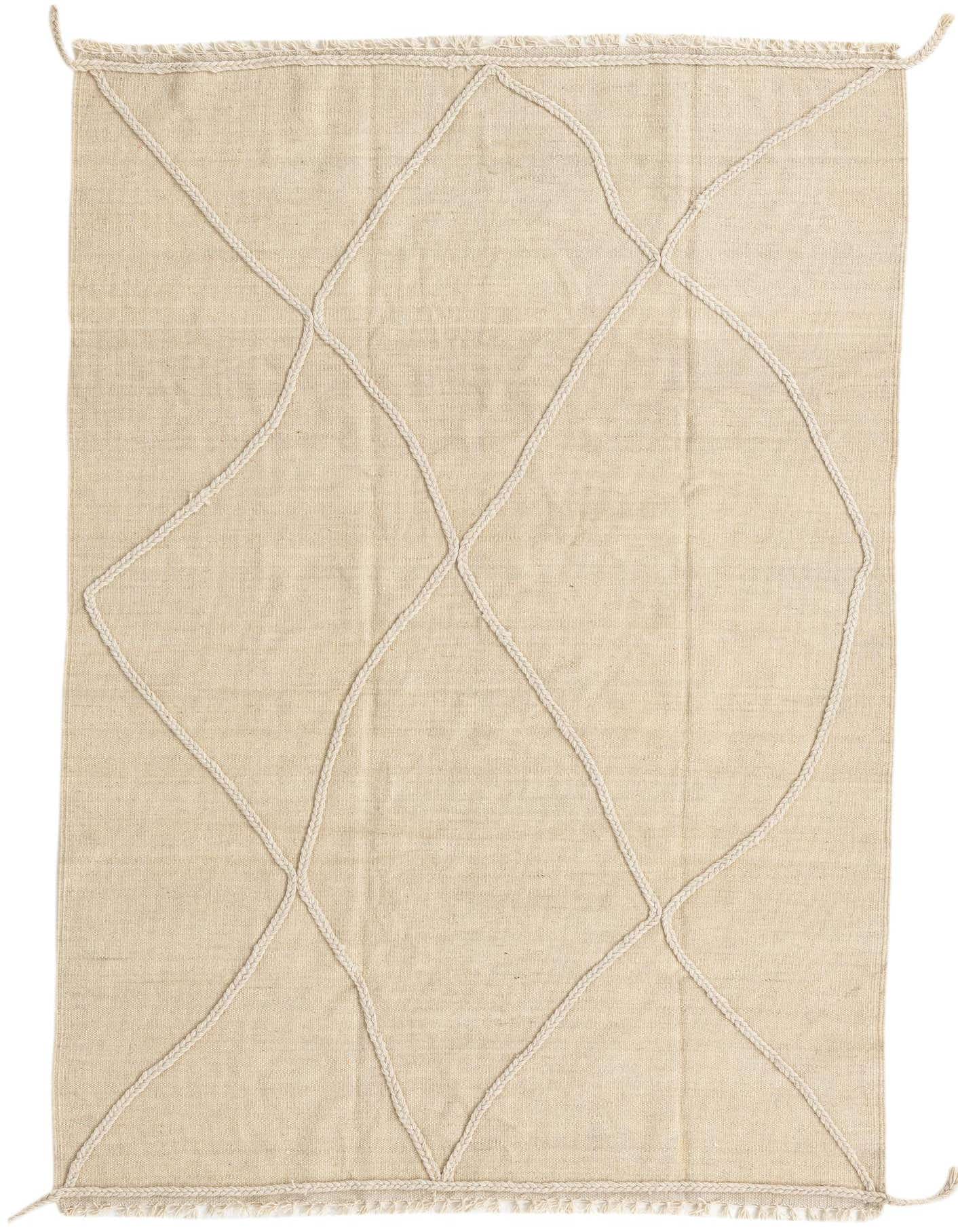 A 4x6 rectangular ivory wool shag rug featuring a subtle tribal abstract pattern made of raised braided lines.