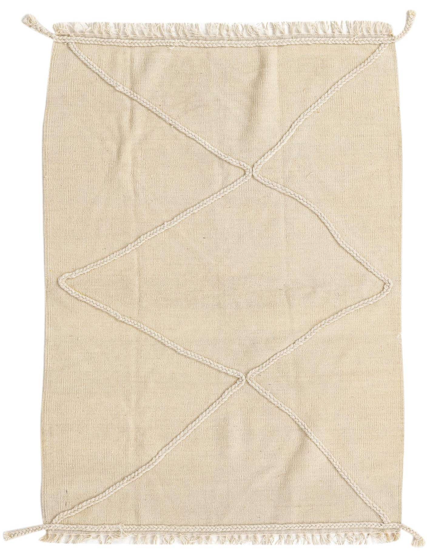 A 3x5 rectangular ivory wool shag rug with a braided diamond tribal pattern and fringed edges.