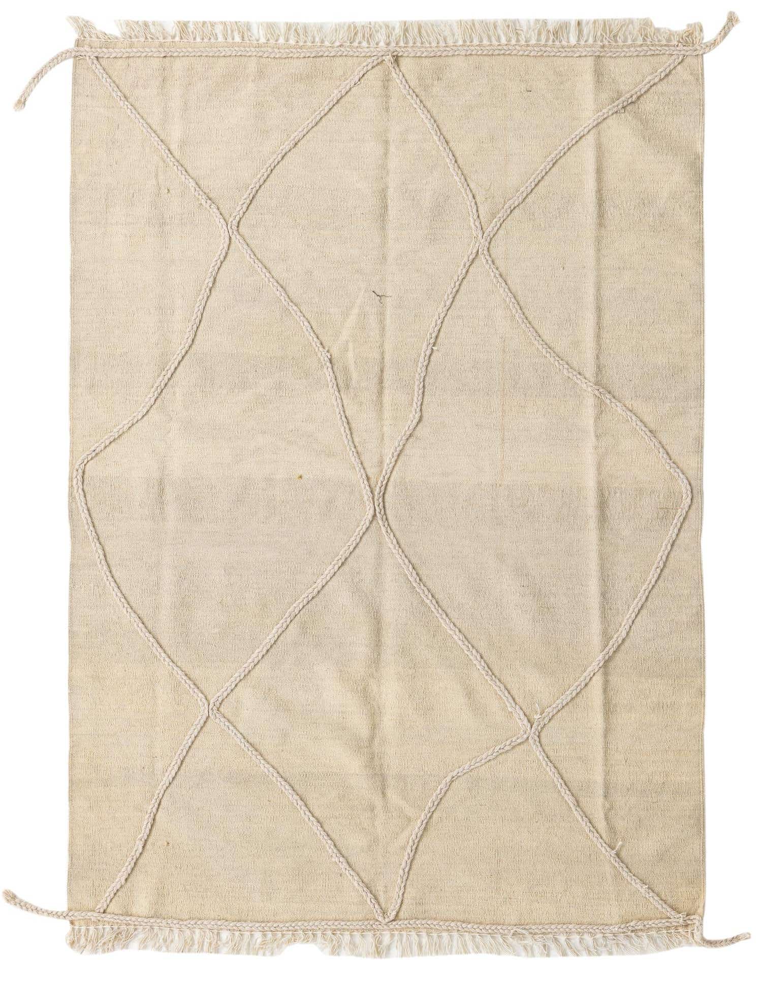 A 4x6 rectangular ivory wool shag rug featuring a modern tribal diamond pattern formed by braided ropes, with fringed edges.