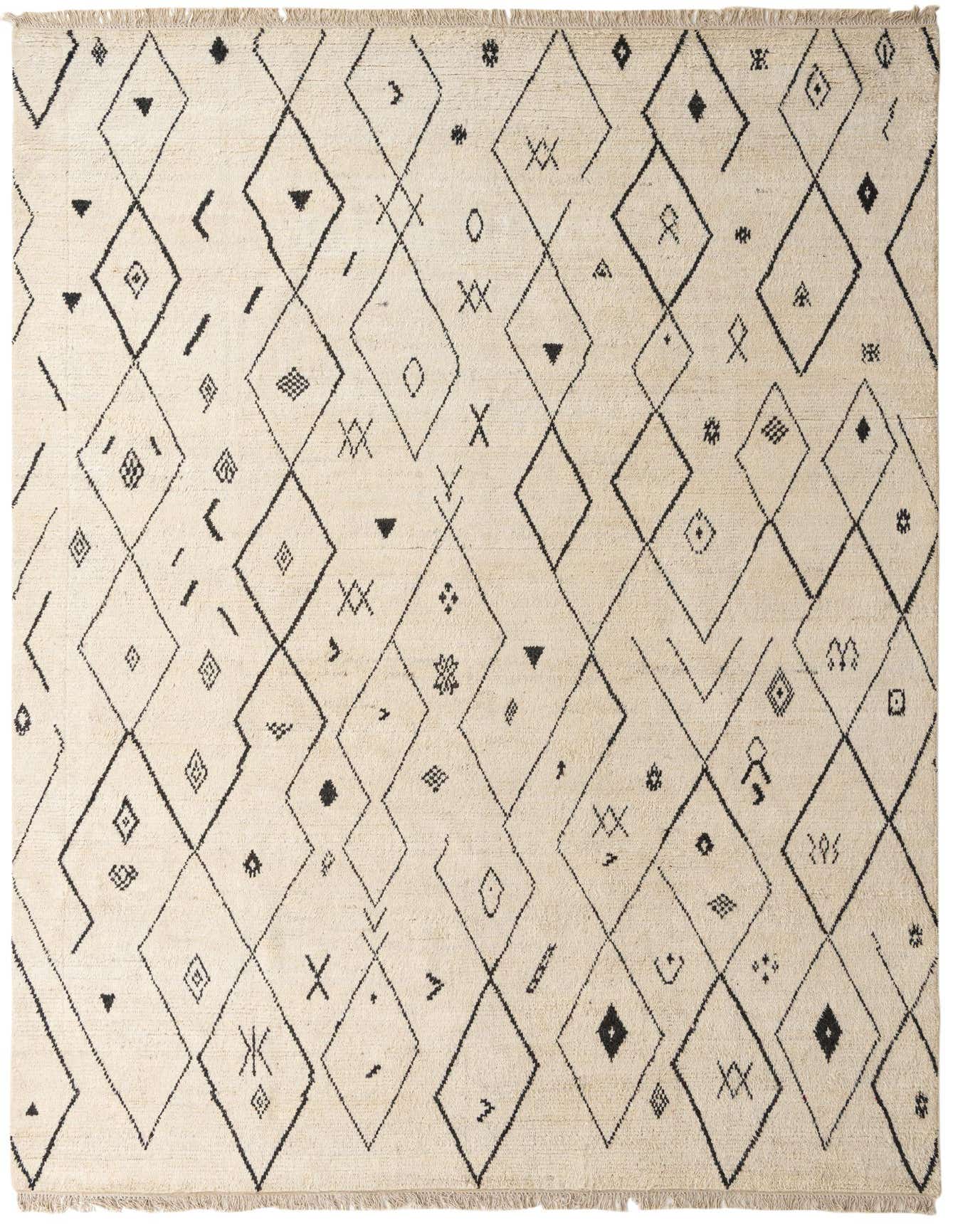 A 10x14 rectangular ivory wool shag rug featuring a modern tribal pattern of black diamonds and abstract symbols.