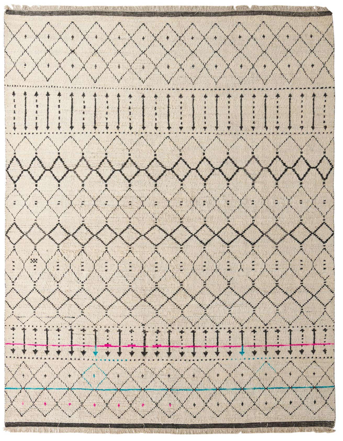 A 10x16 rectangular ivory wool shag rug with a modern tribal pattern of black, pink, and blue geometric designs.