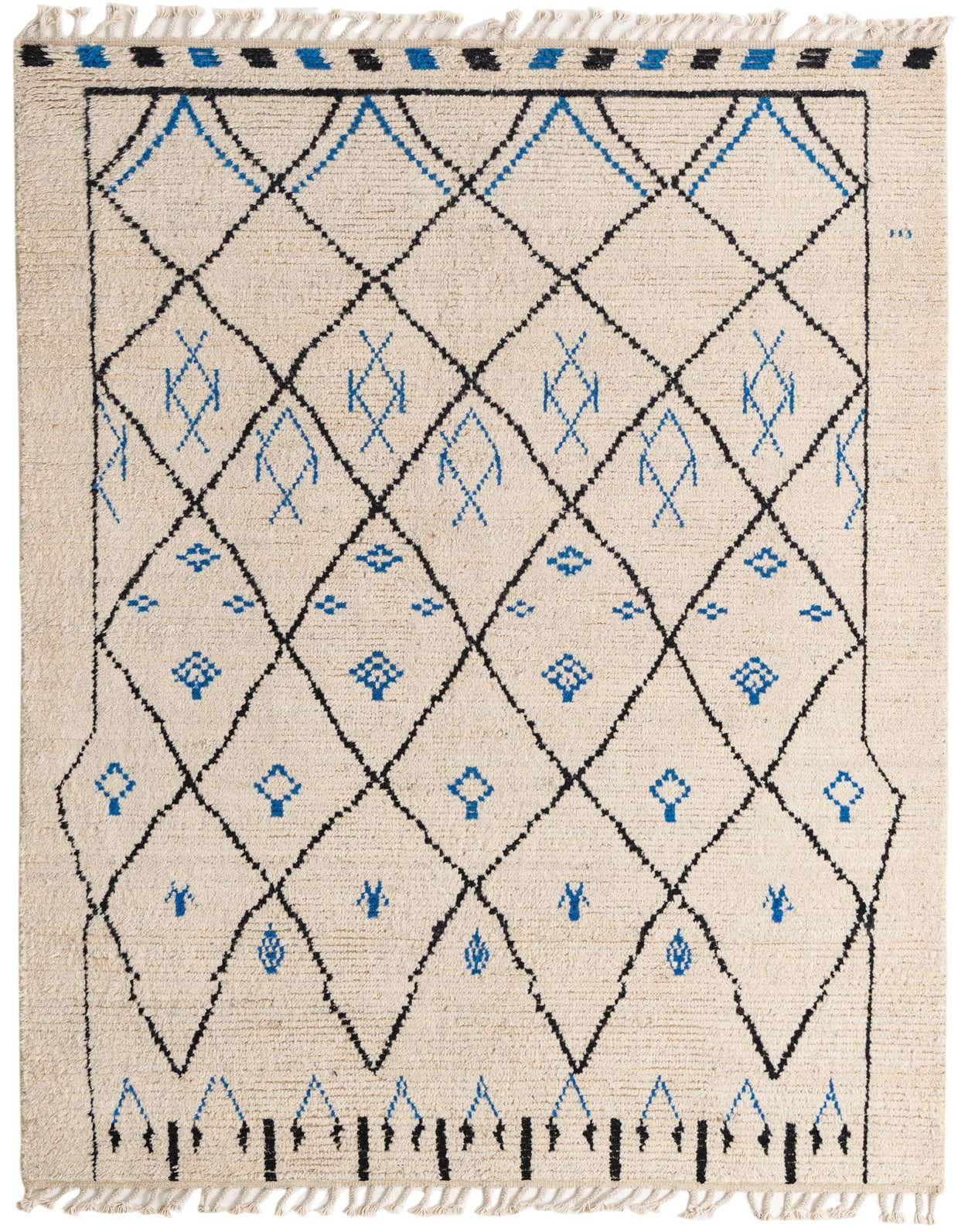 A 6x9 rectangular ivory shag rug with a bold black diamond trellis pattern and blue tribal accents.