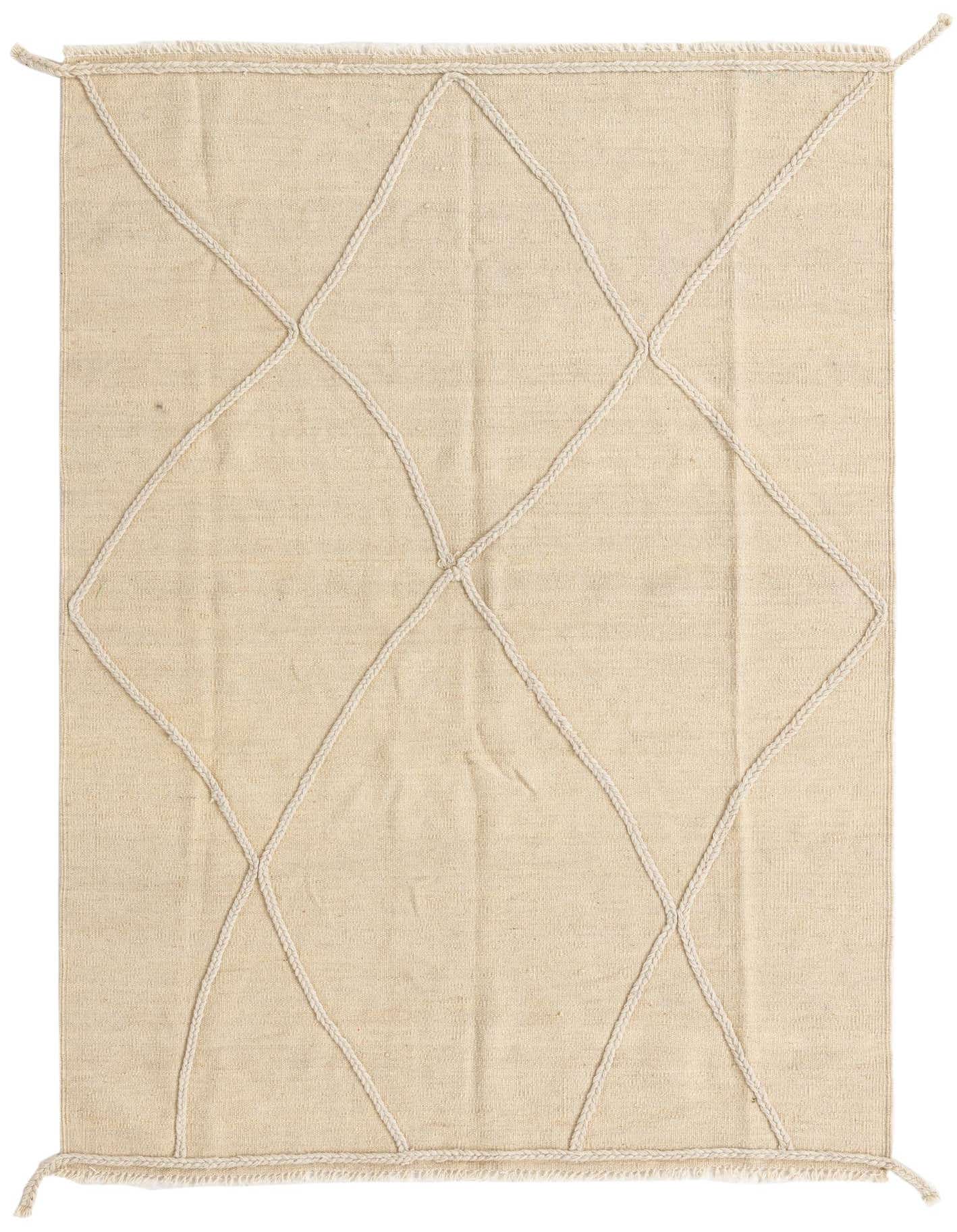 A 4x6 rectangular ivory wool shag rug with a modern tribal diamond pattern, perfect for a living room.