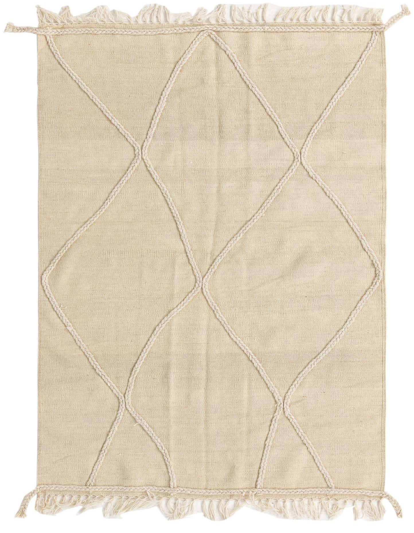 A 3x5 rectangular ivory wool shag rug with a raised diamond tribal pattern and fringed edges.