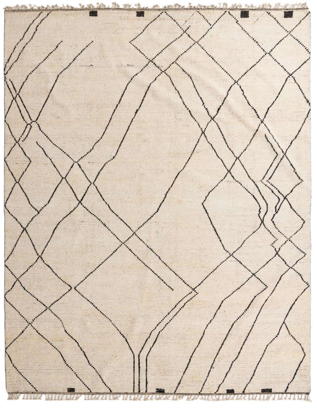 A 10x14 rectangular ivory wool shag rug with a modern tribal abstract pattern of thin black lines and small black squares.
