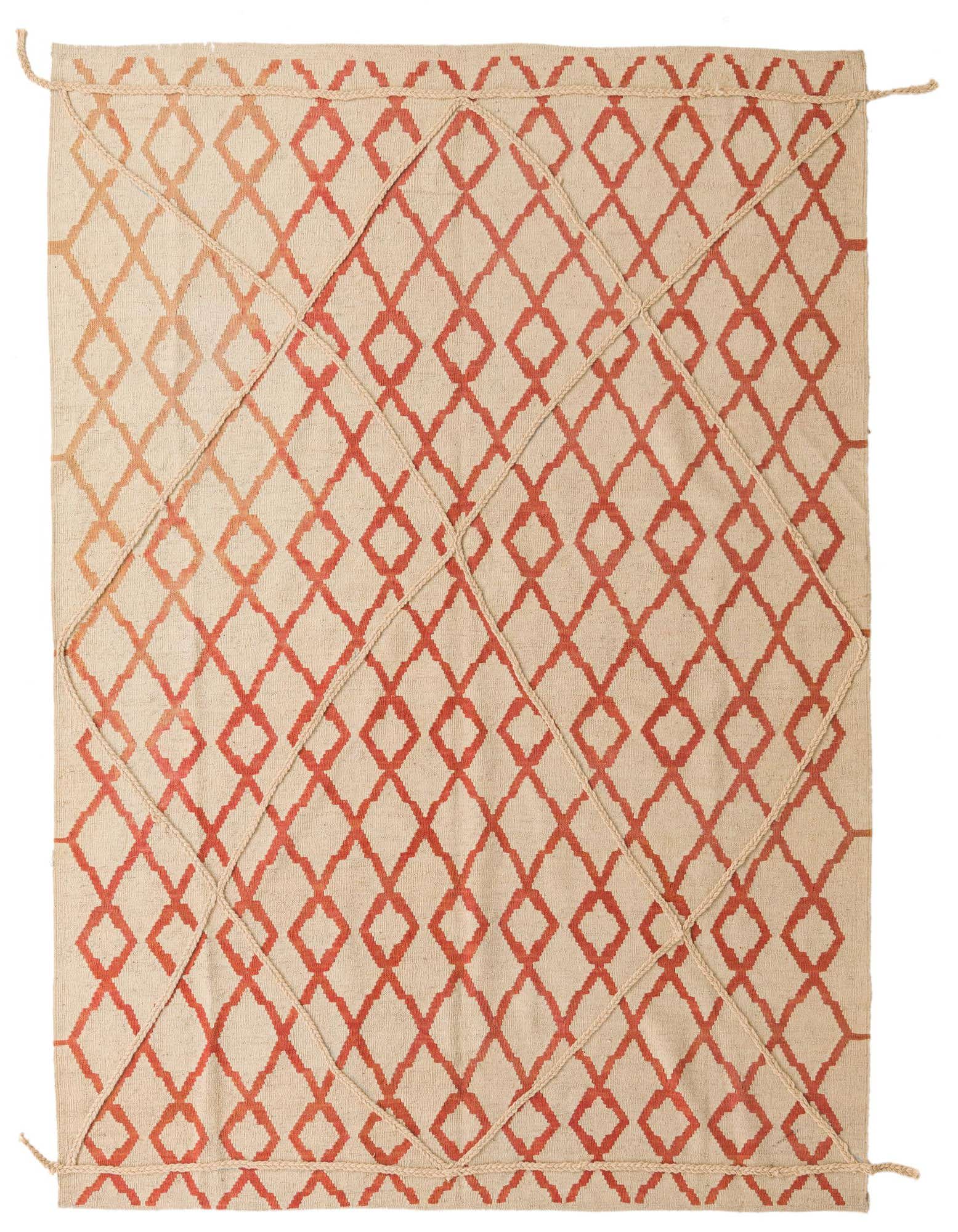 A 6x9 rectangular ivory shag rug with a modern tribal pattern of interlocking red diamonds and braided details.