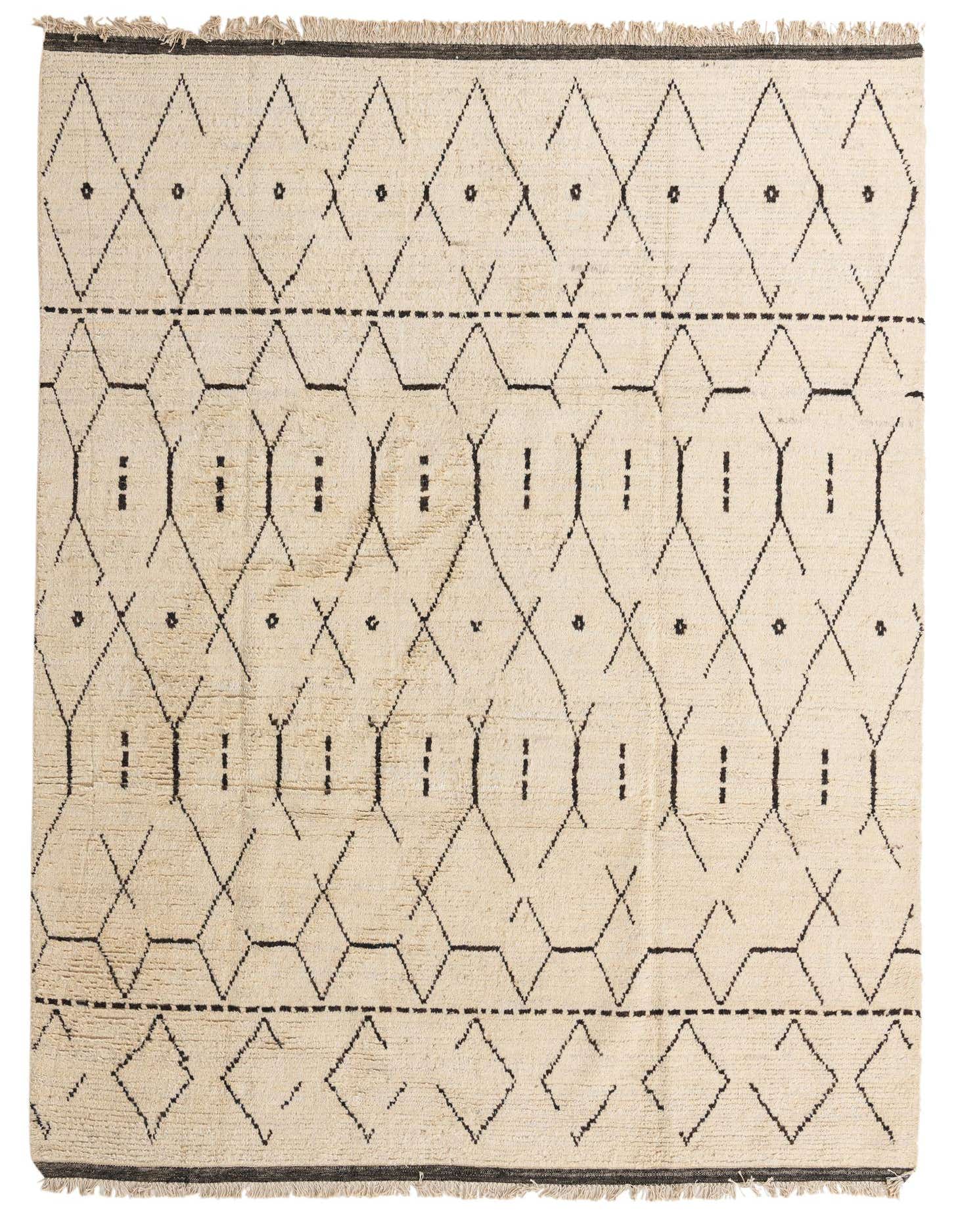 An 8x11 rectangular ivory wool shag rug with a modern tribal geometric pattern in black, featuring diamonds and abstract shapes.