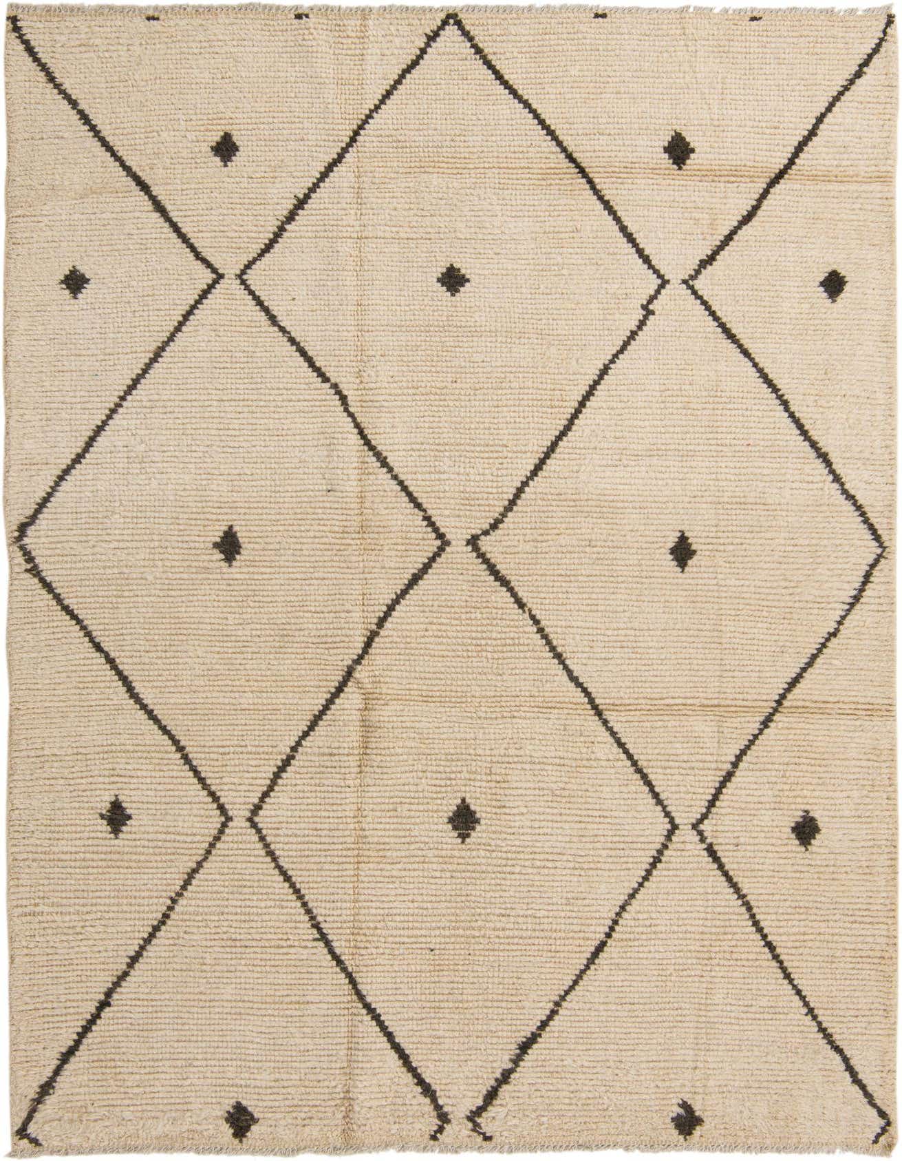 A 6x9 rectangular ivory shag rug with a bold black tribal diamond pattern and small black diamond accents, suitable for a living room.