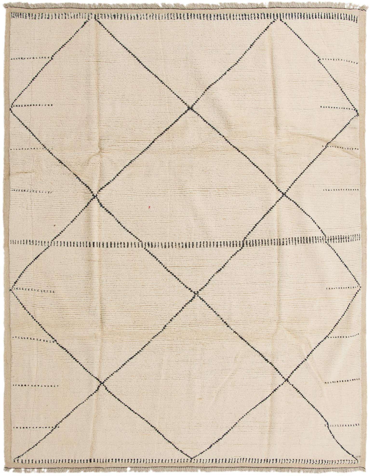 An 8x10 rectangular ivory shag rug with a black tribal diamond pattern, ideal for a modern living room.