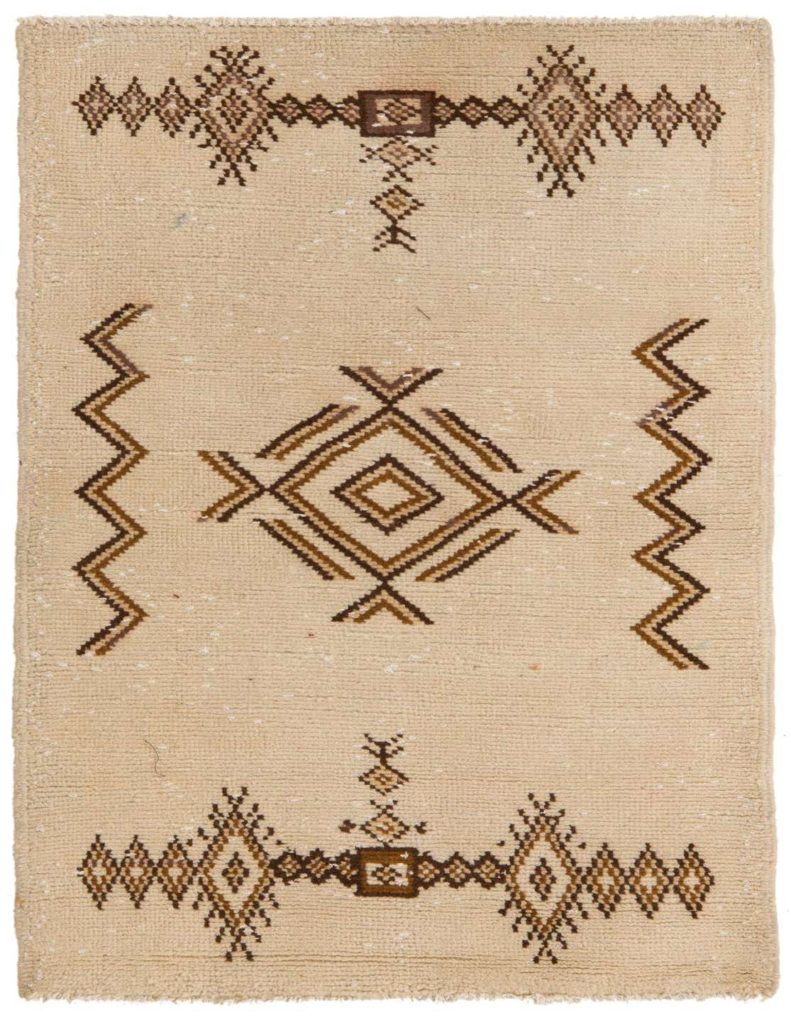 A 3x5 rectangular ivory shag rug with a brown tribal geometric pattern, suitable for a modern living room.