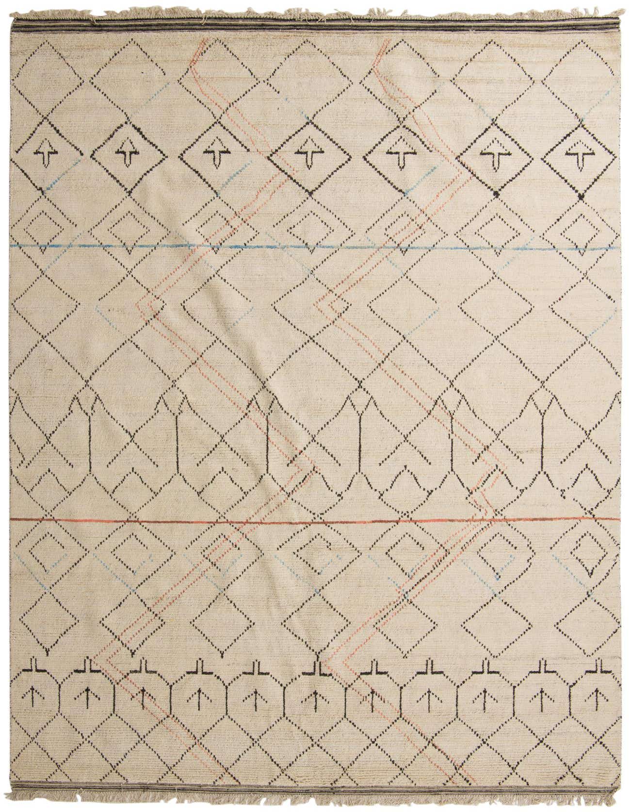 A 10x16 rectangular ivory wool shag rug with a modern tribal pattern of black, blue, and coral geometric lines and diamonds.