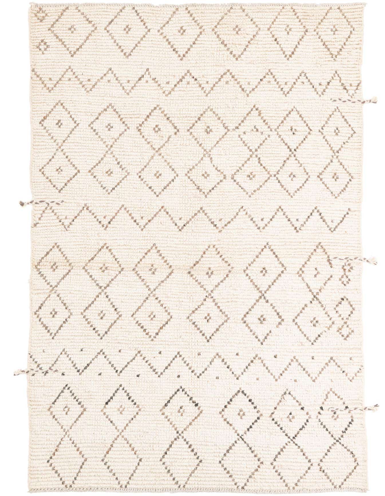 A 4x6 rectangular ivory shag rug with a modern tribal diamond and zigzag pattern in natural brown tones.