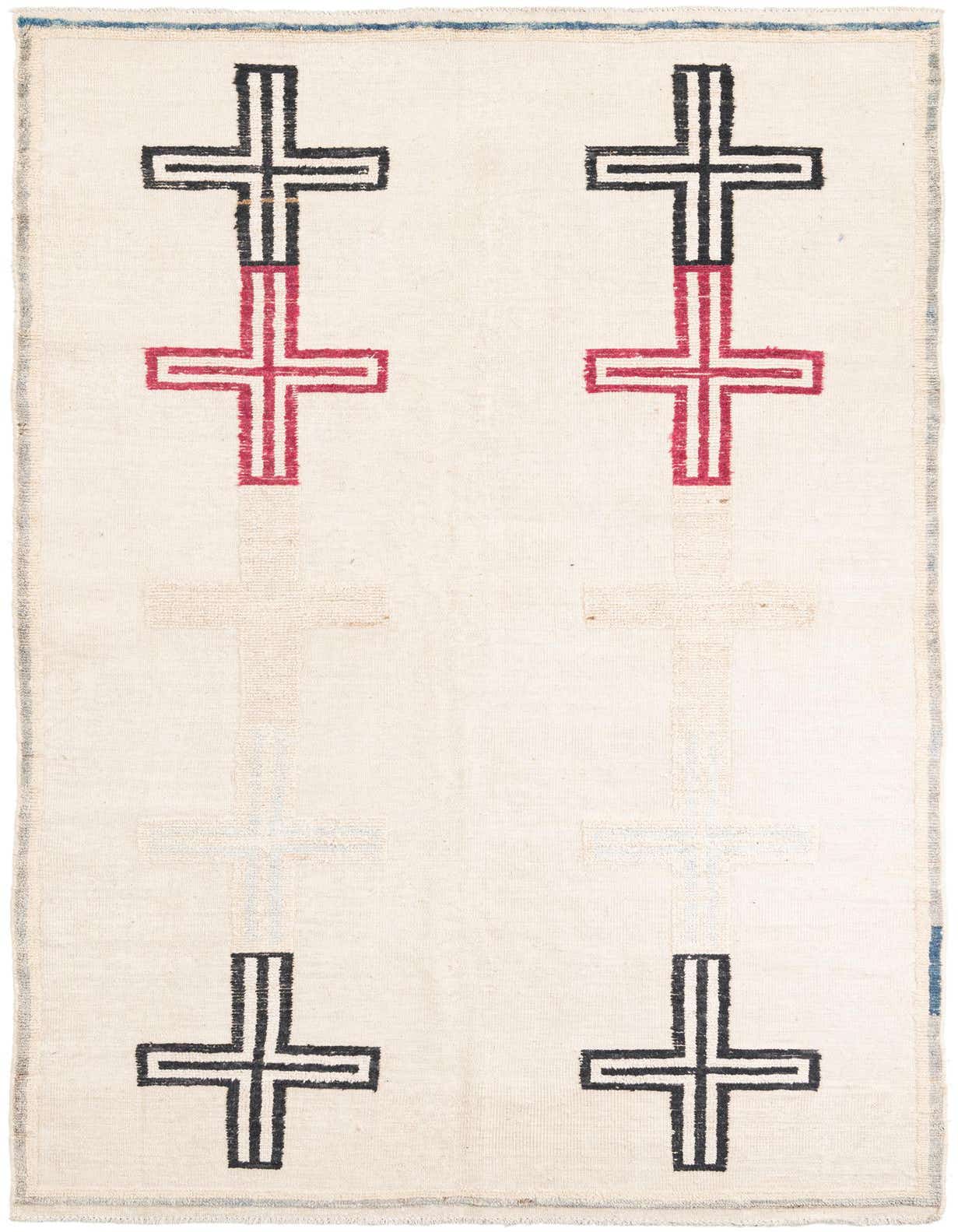 A 6x9 rectangular ivory wool shag rug featuring a modern tribal pattern of large black and red crosses.