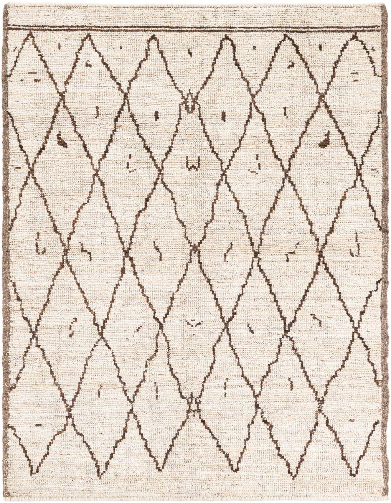 A 4x6 rectangular ivory shag rug with a brown tribal diamond pattern, ideal for a modern living room.